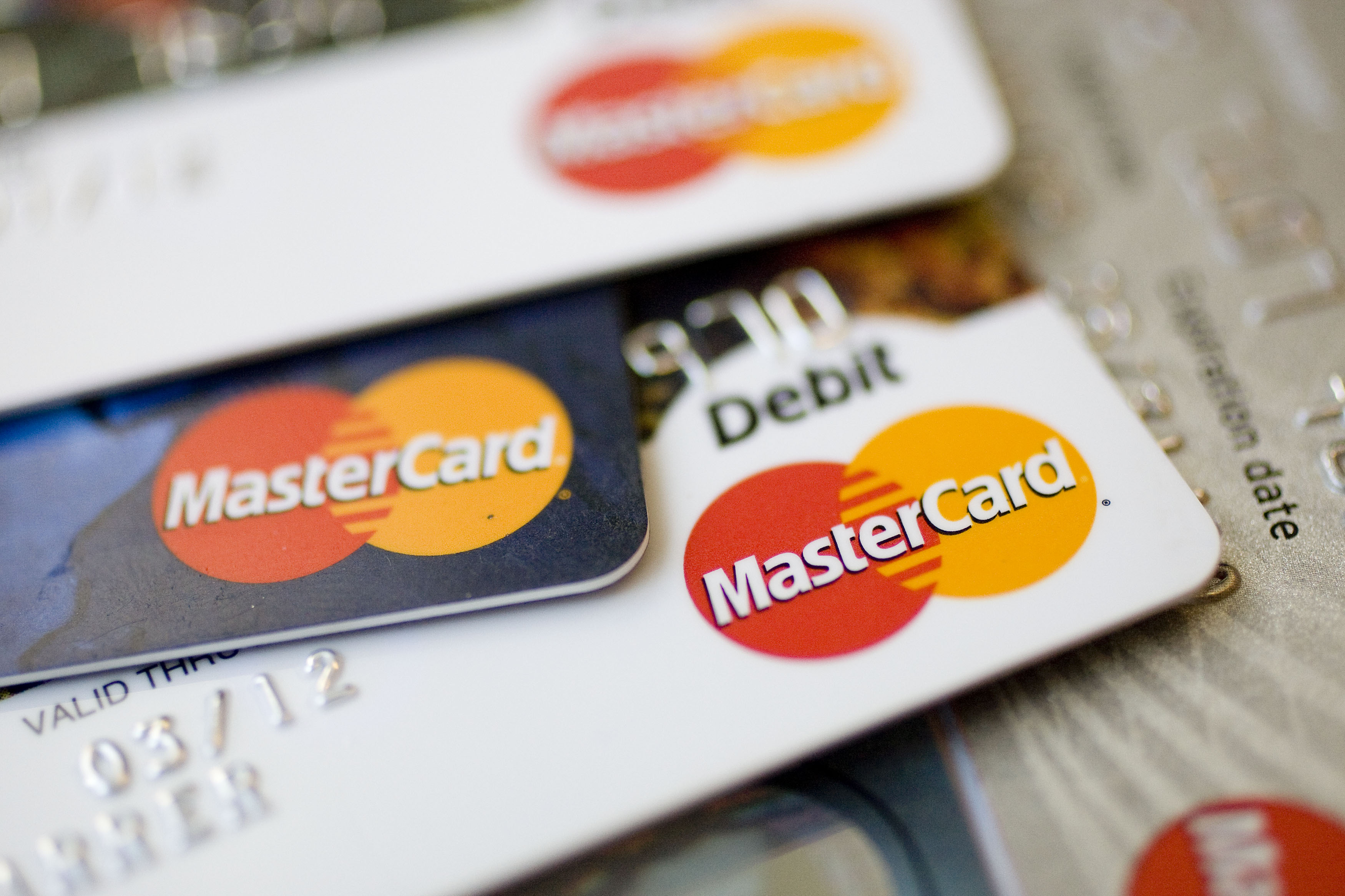 MasterCard logos appear on credit and debit cards arranged for a photograph in New York, U.S., on Thursday, July 30, 2009.