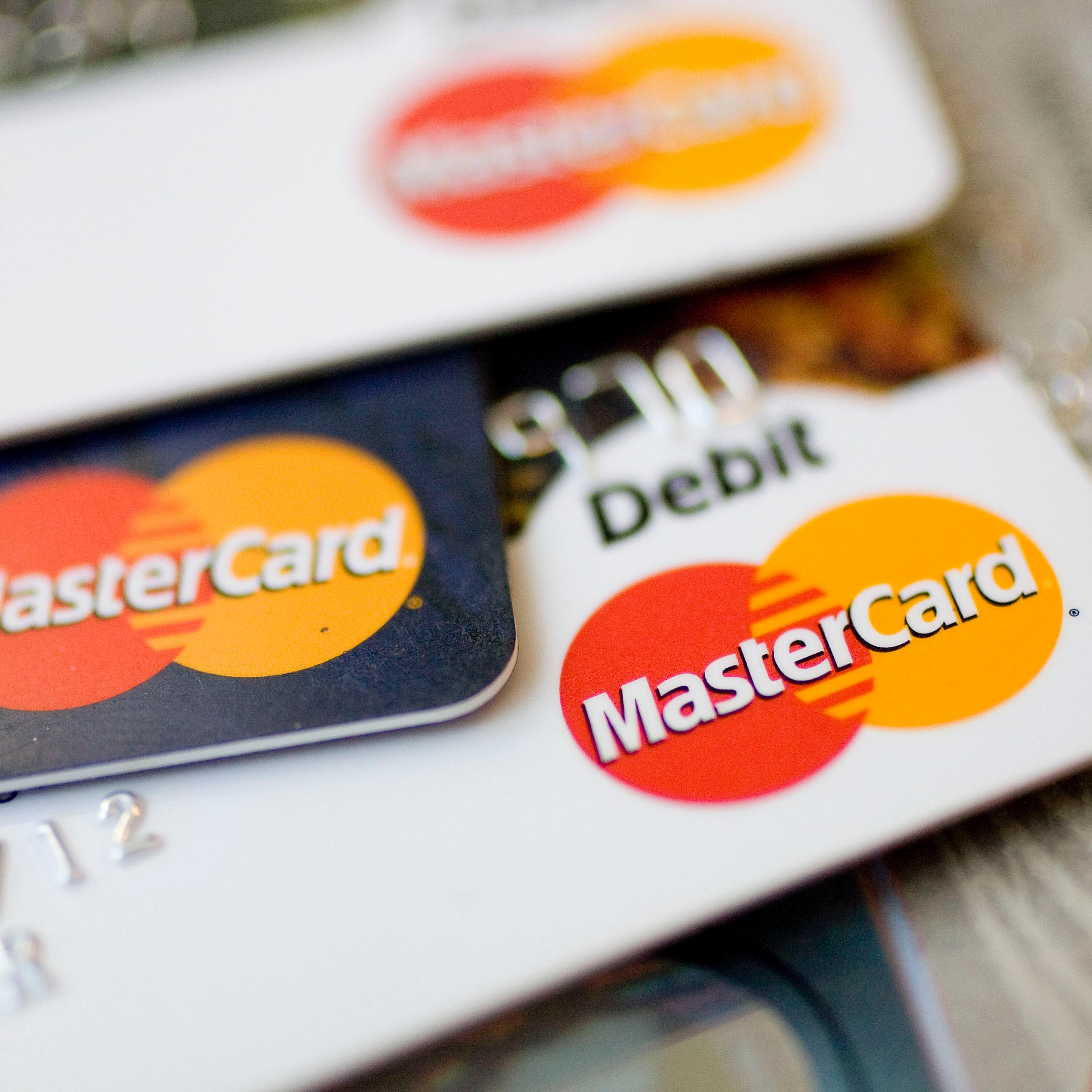 MasterCard logos appear on credit and debit cards arranged for a photograph in New York, U.S., on Thursday, July 30, 2009.