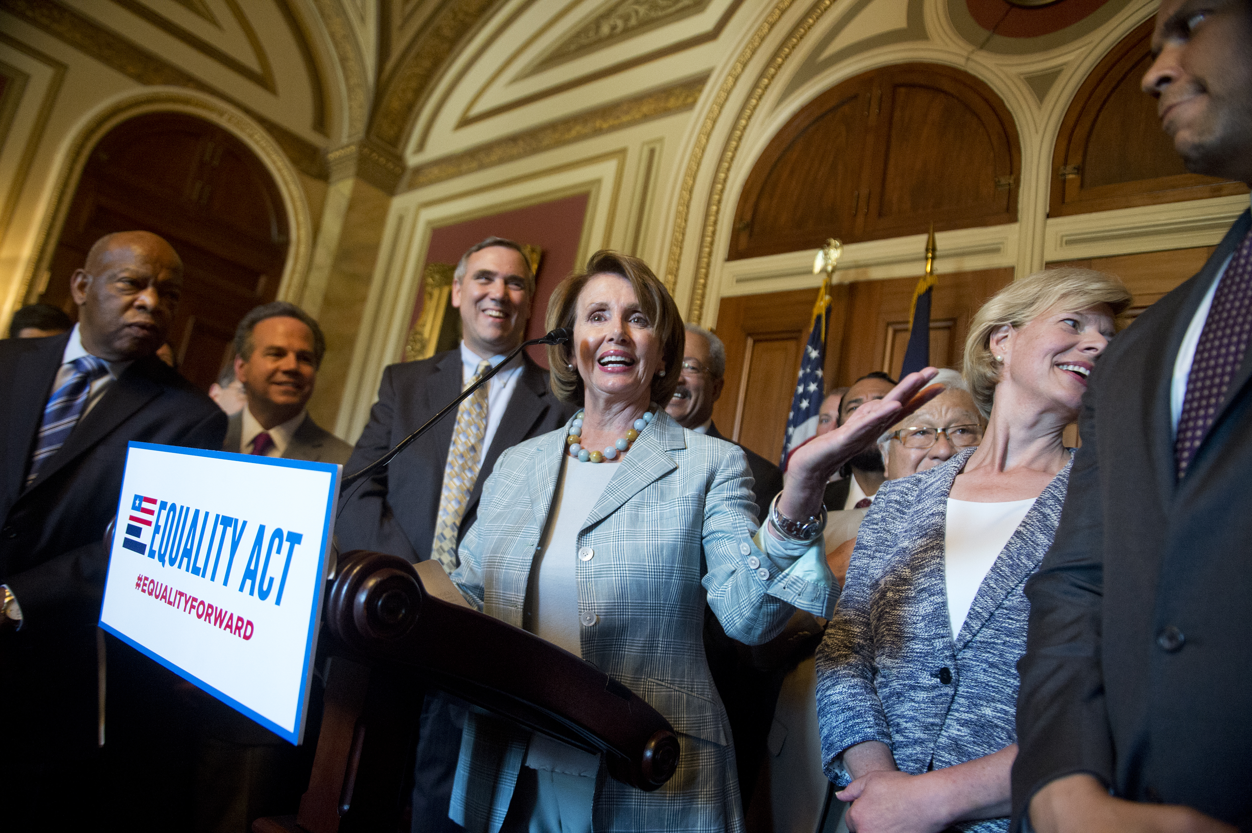 UNITED STATES - JULY 23: House Minority Leader Nancy Pelosi, D-Calif., during an event in the Capitol on the Equality Act that bans discrimination against LGBT people in federal law, July 23, 2015. Also appearing, from left, are Reps. John Lewis, D-Ga., 