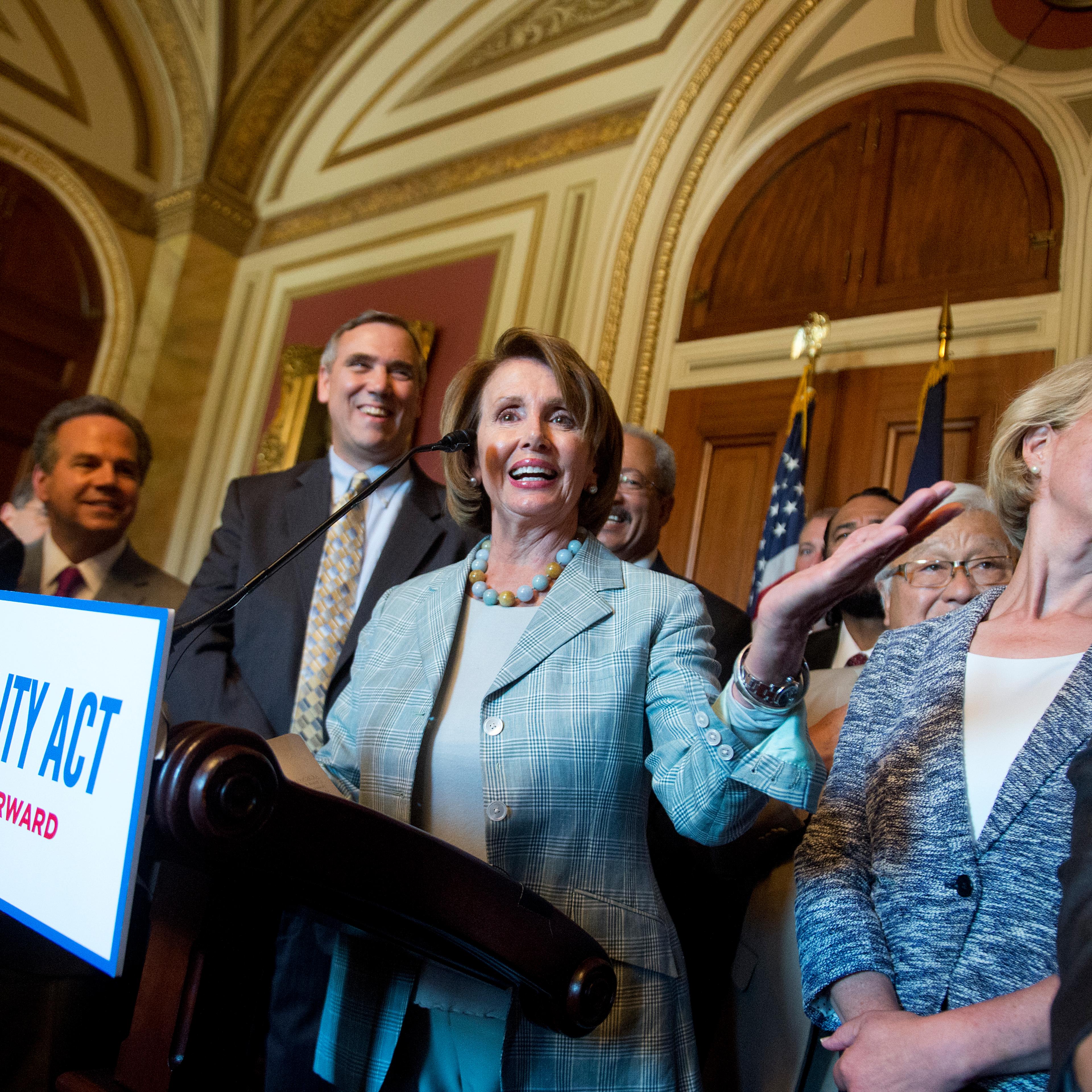 UNITED STATES - JULY 23: House Minority Leader Nancy Pelosi, D-Calif., during an event in the Capitol on the Equality Act that bans discrimination against LGBT people in federal law, July 23, 2015. Also appearing, from left, are Reps. John Lewis, D-Ga.,