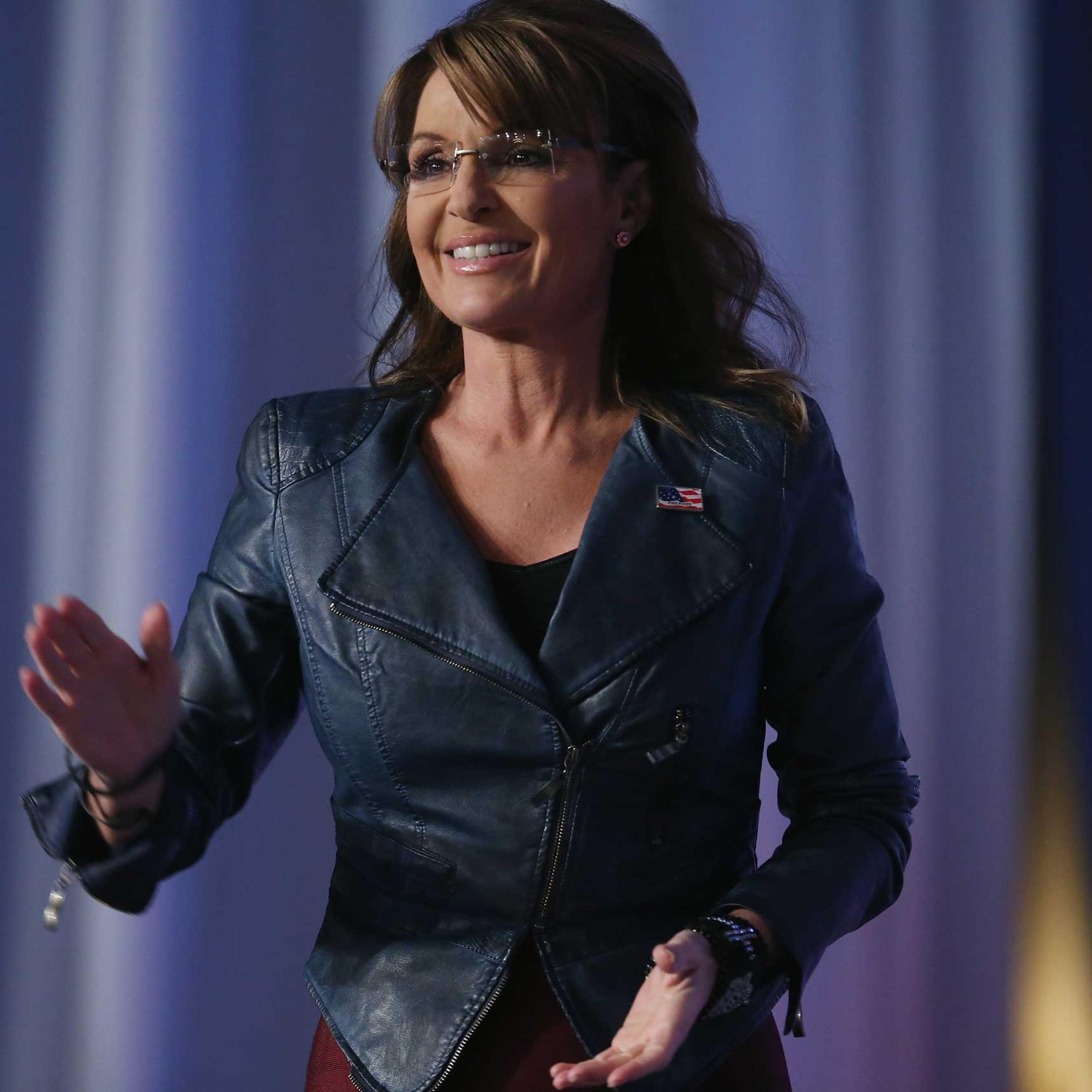 Former Alaska Gov. Sarah Palin (R) walks onstage to speak at the 2014 Values Voter Summit in Washington on Sept. 26, 2014.