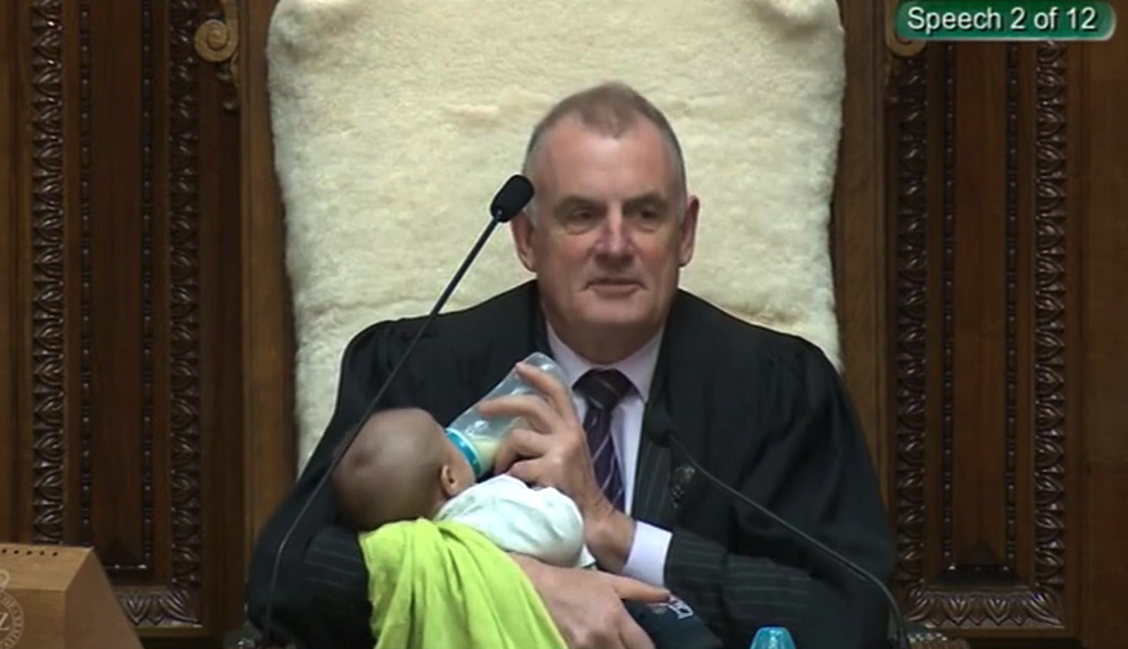 New Zealand speaker Trevor Mallard cradles baby during parliament debate