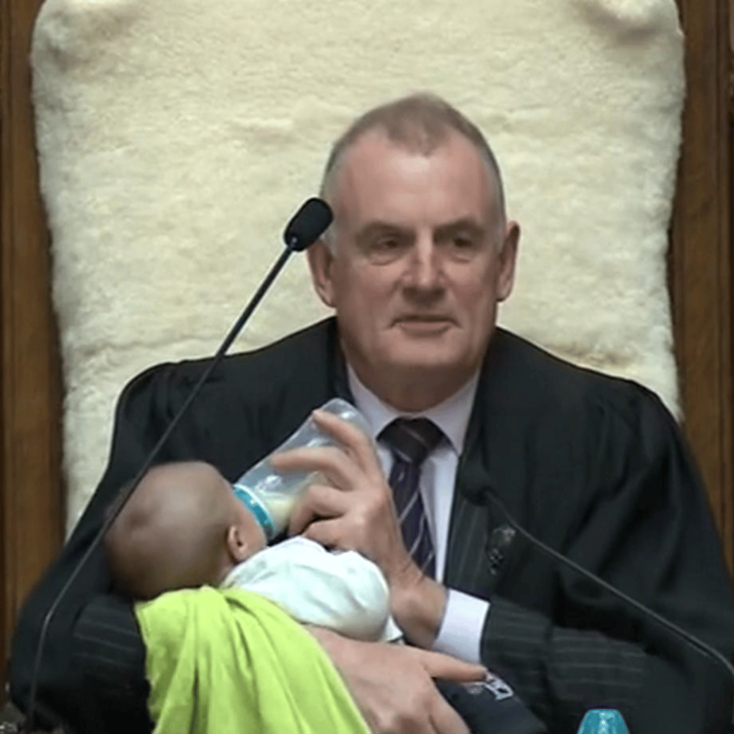 New Zealand speaker Trevor Mallard cradles baby during parliament debate
