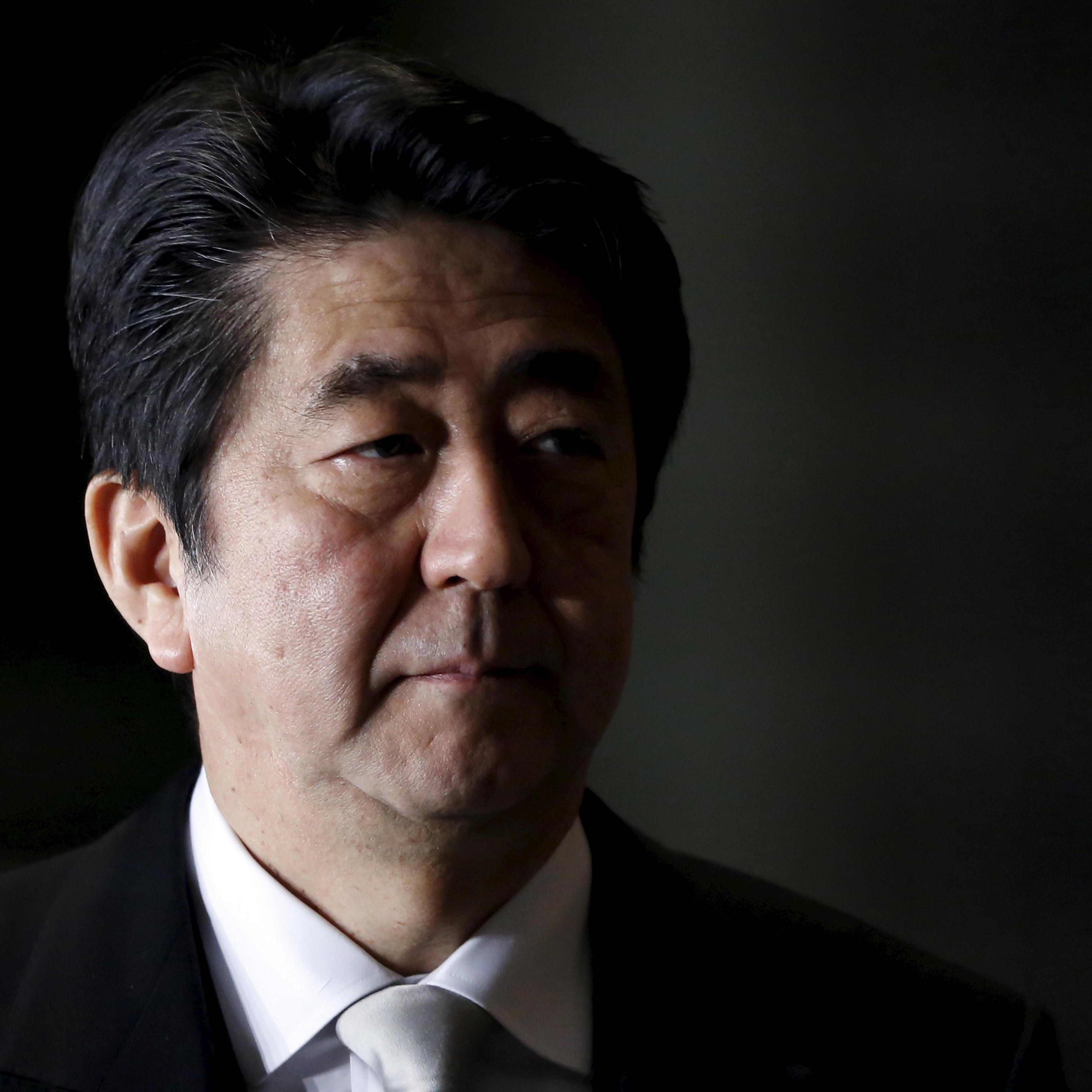 Japan's Prime Minister Abe walks into Abe's official residence in Tokyo
