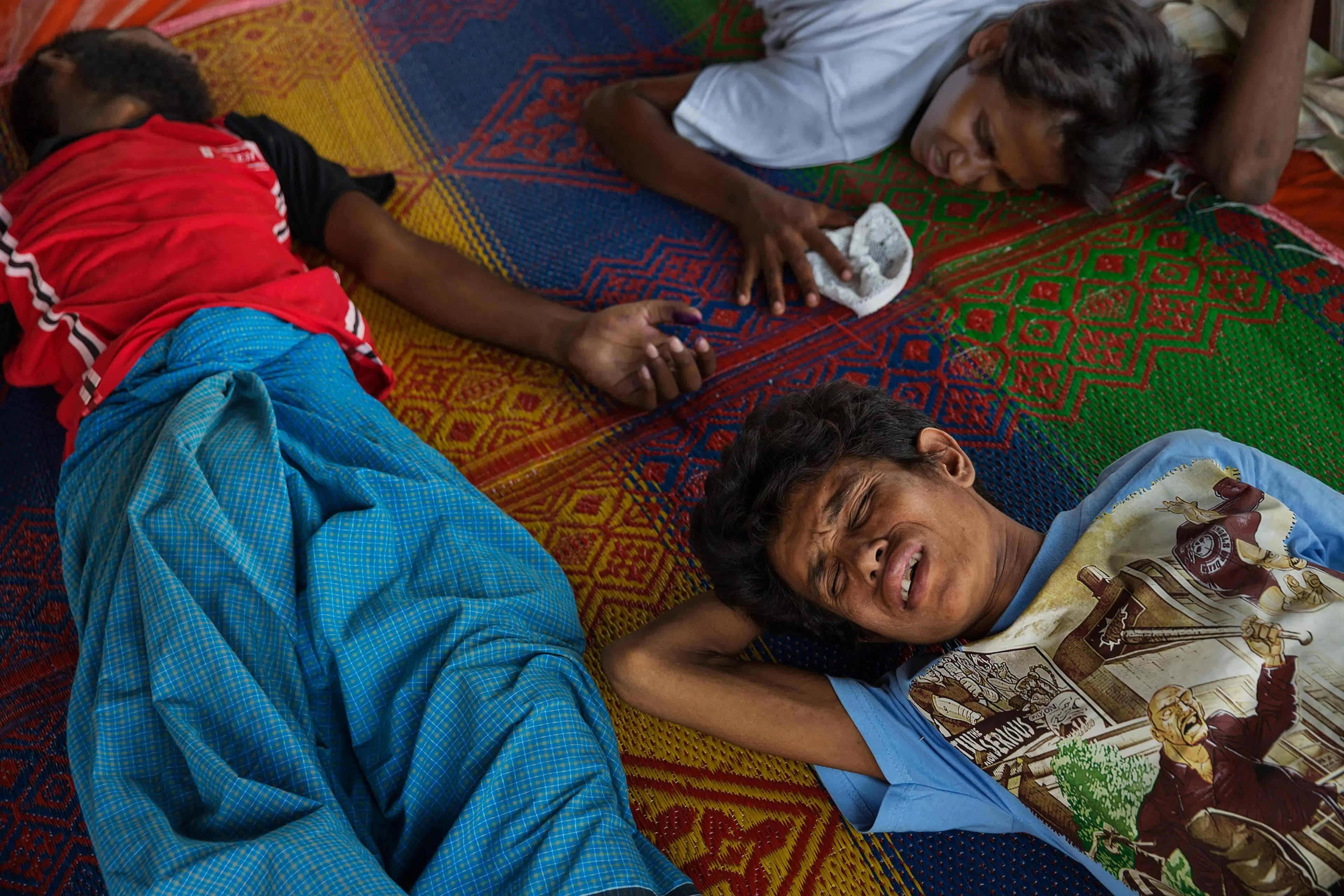 Rohingya and Bangladeshi refugees aboard boats that have been at sea for months off the coast of SE Asia. Landed in port pif Langsa in Aceh, Indonesia, where they were given shelter, food and medical care by Indonesian and international NGO's. The Rohing
