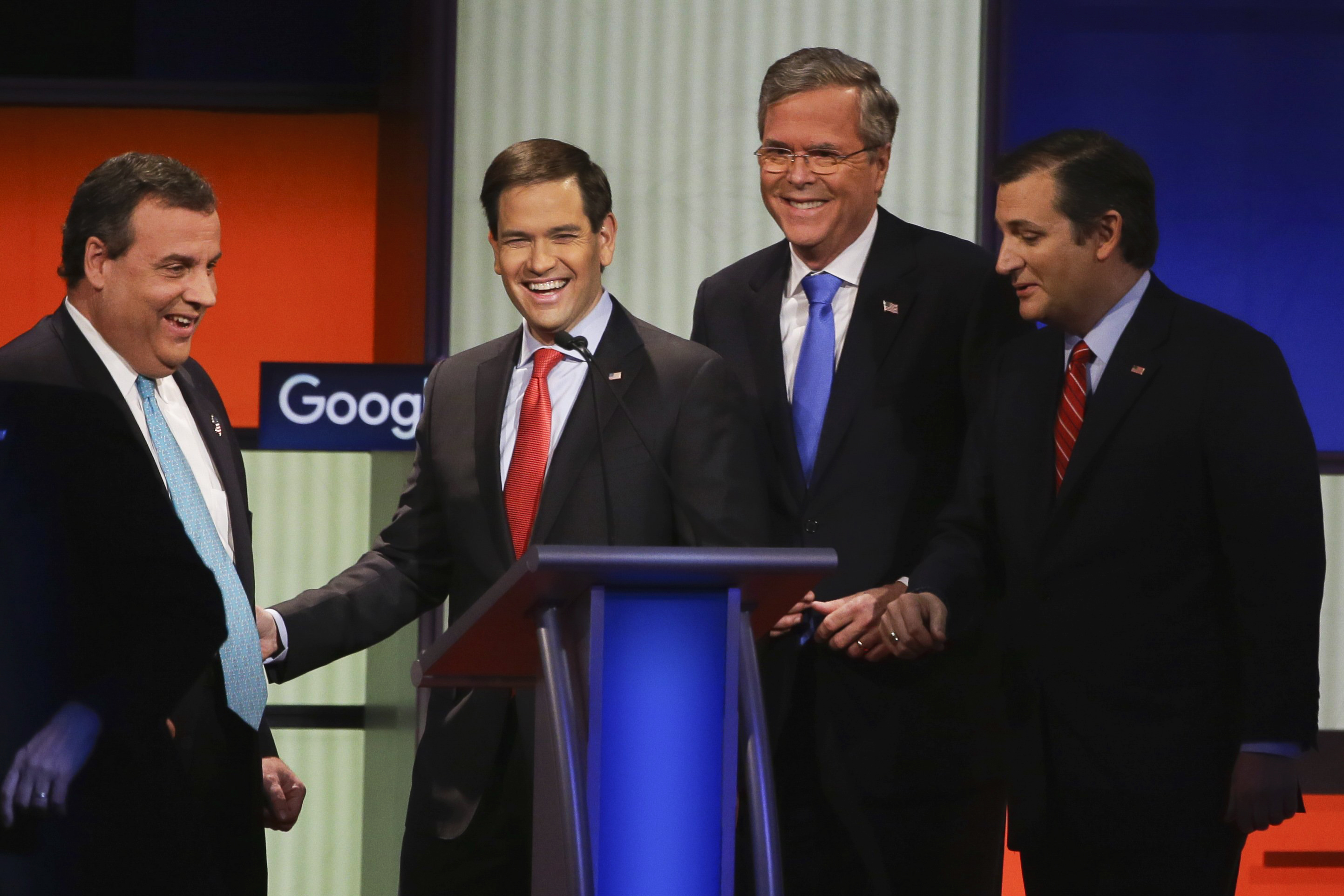Republican presidential candidates, from left, New Jersey Gov. Chris Christie, Sen. Marco Rubio, R-Fla., former Florida Gov. Jeb Bush and Sen. Ted Cruz, R-Texas, talk after the Republican presidential primary debate, Thursday, Jan. 28, 2016, in Des Moine