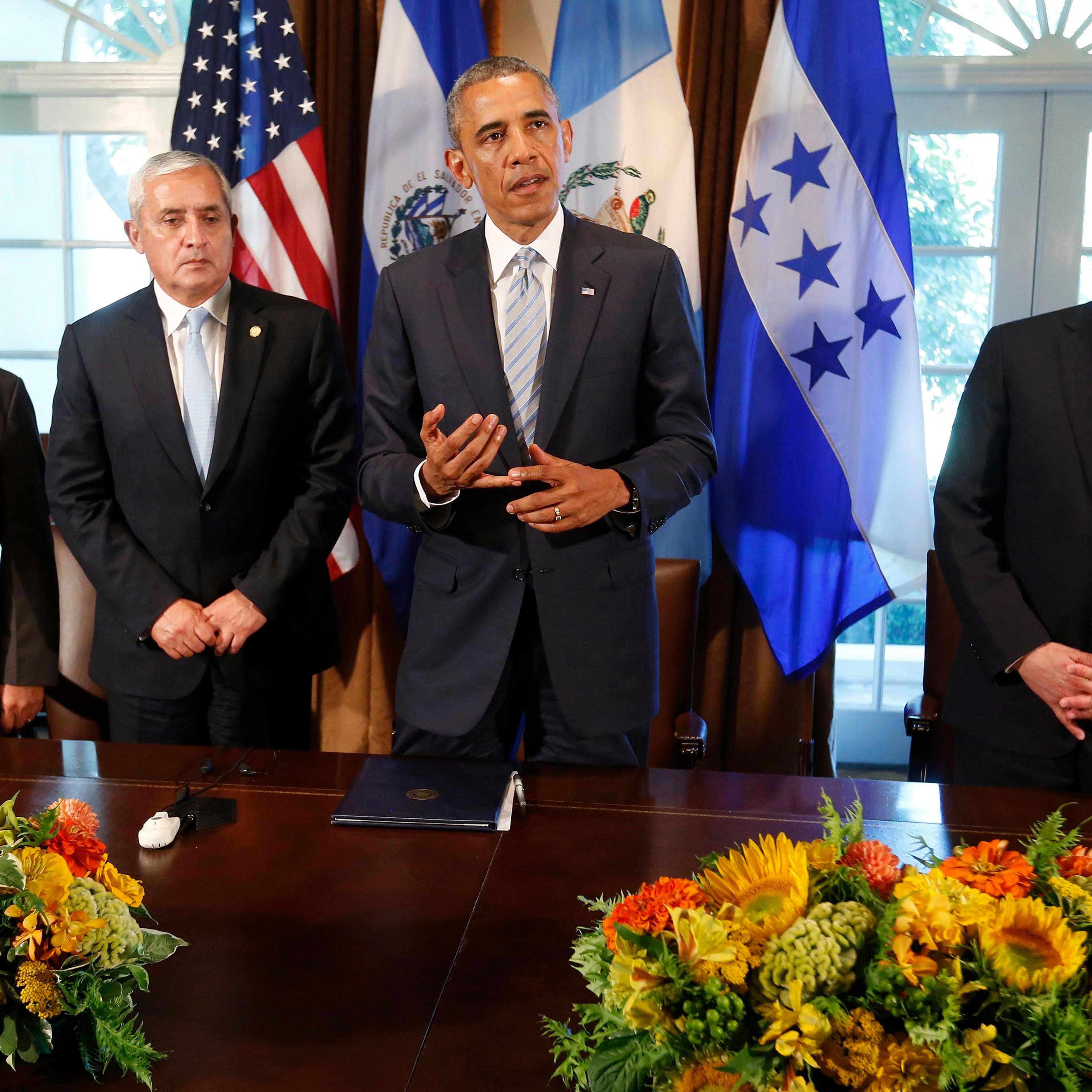 U.S. President Obama speaks to the media while he hosts a meeting with El Salvador's President Sanchez Ceren, Guatemala's President Perez Molina and Honduras' President Orlando Hernandez in the Cabinet Room of the White House in Washington