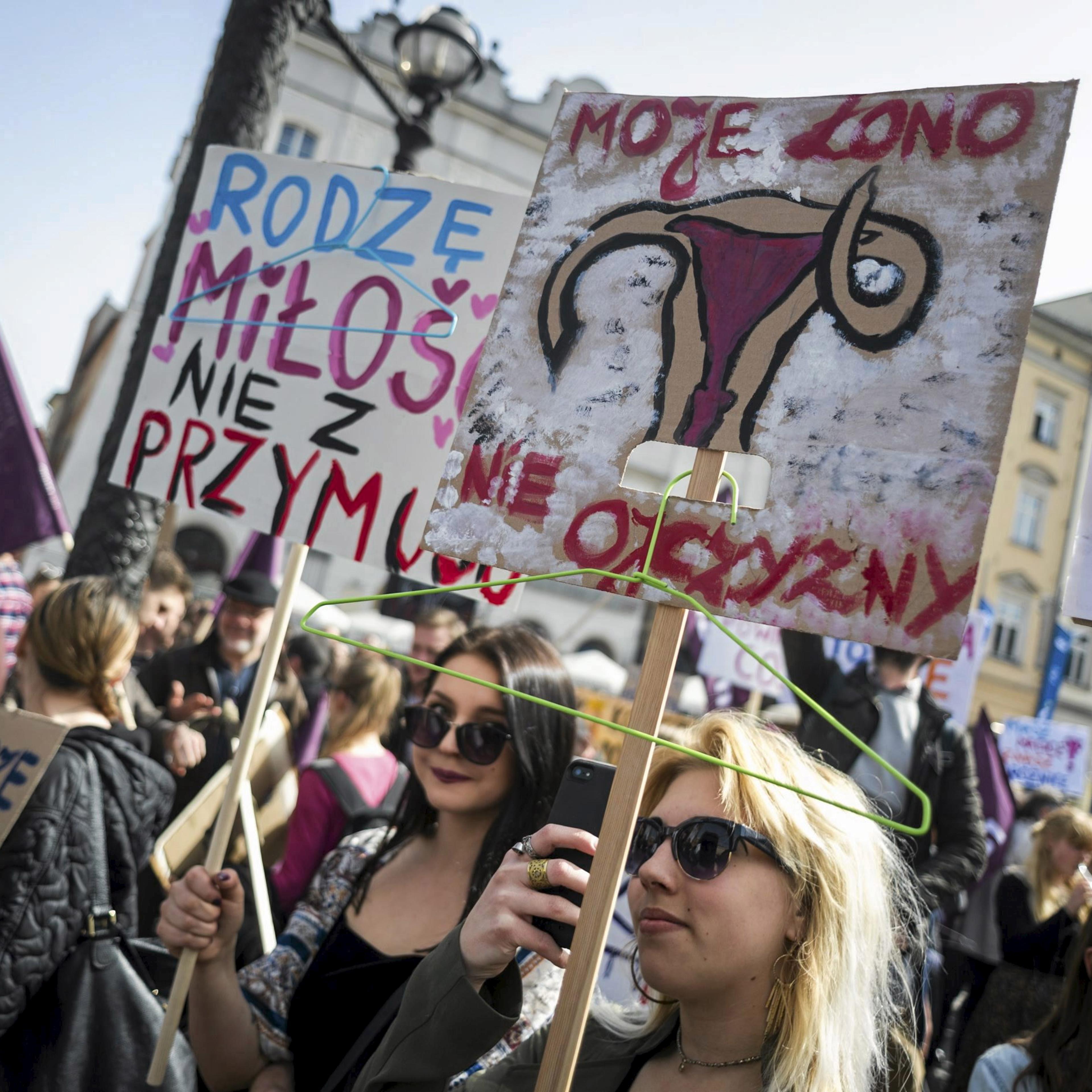 People demonstrate against the Polish government's plans of tightening the abortion law in Krakow, Poland