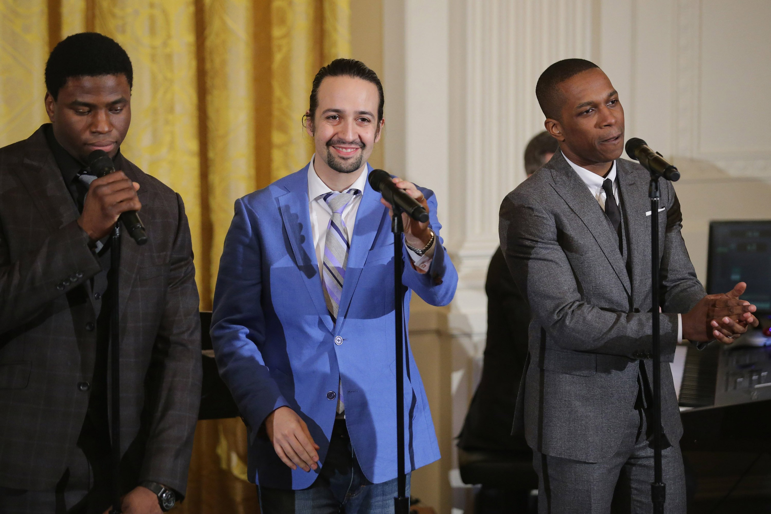 WASHINGTON, DC - MARCH 14: Members of the Broadway cast of 'Hamilton,' including (L-R) Okieriete Onaodowan, creator and star Lin-Manuel Miranda and Leslie Odom Jr., perform music from the production in the East Room of the White House March 14, 2016 in W