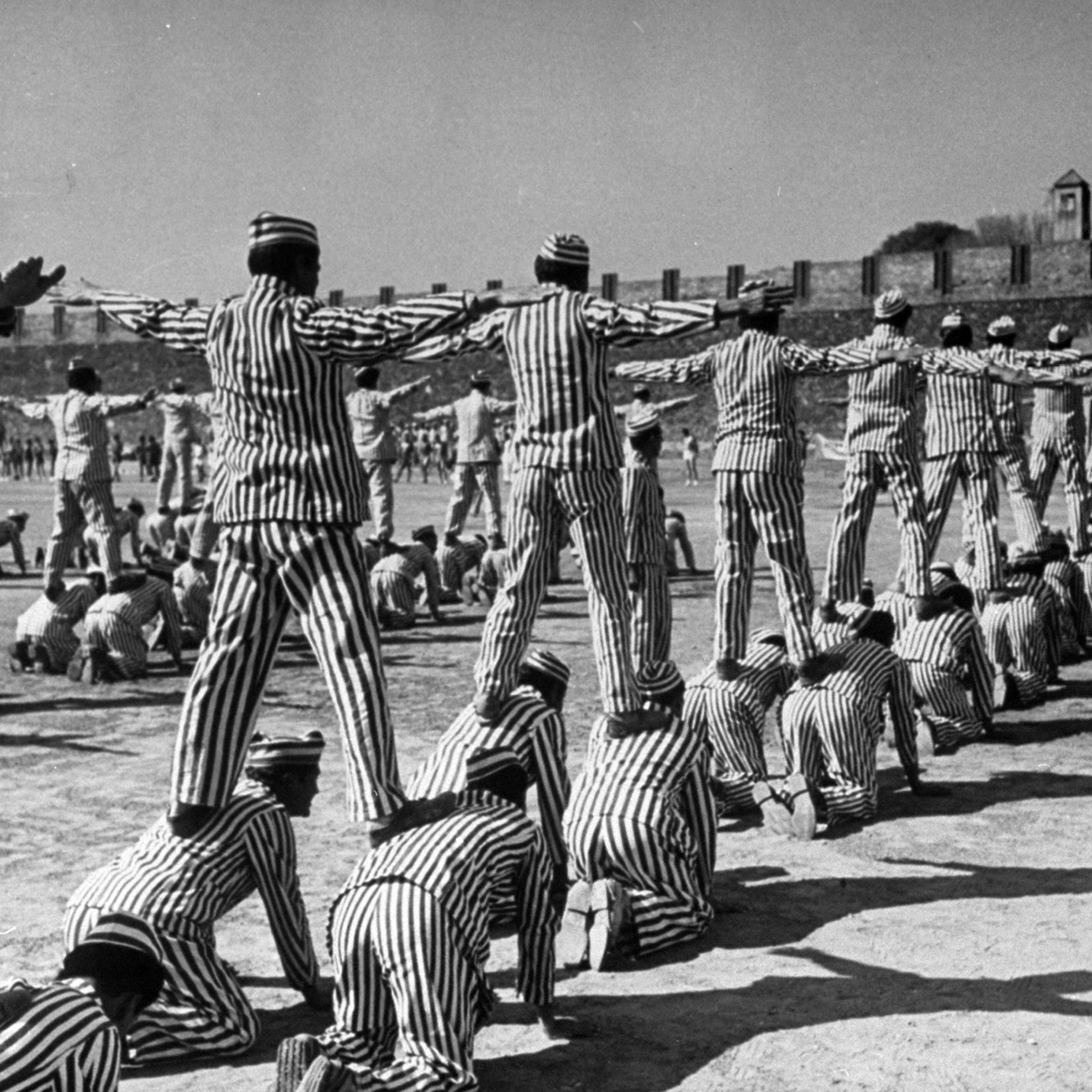 Mass calisthenics use up 4 1/2 hours in the daily routine of most male prisoners. On this same big field they also play softball, volleyball and basketball.