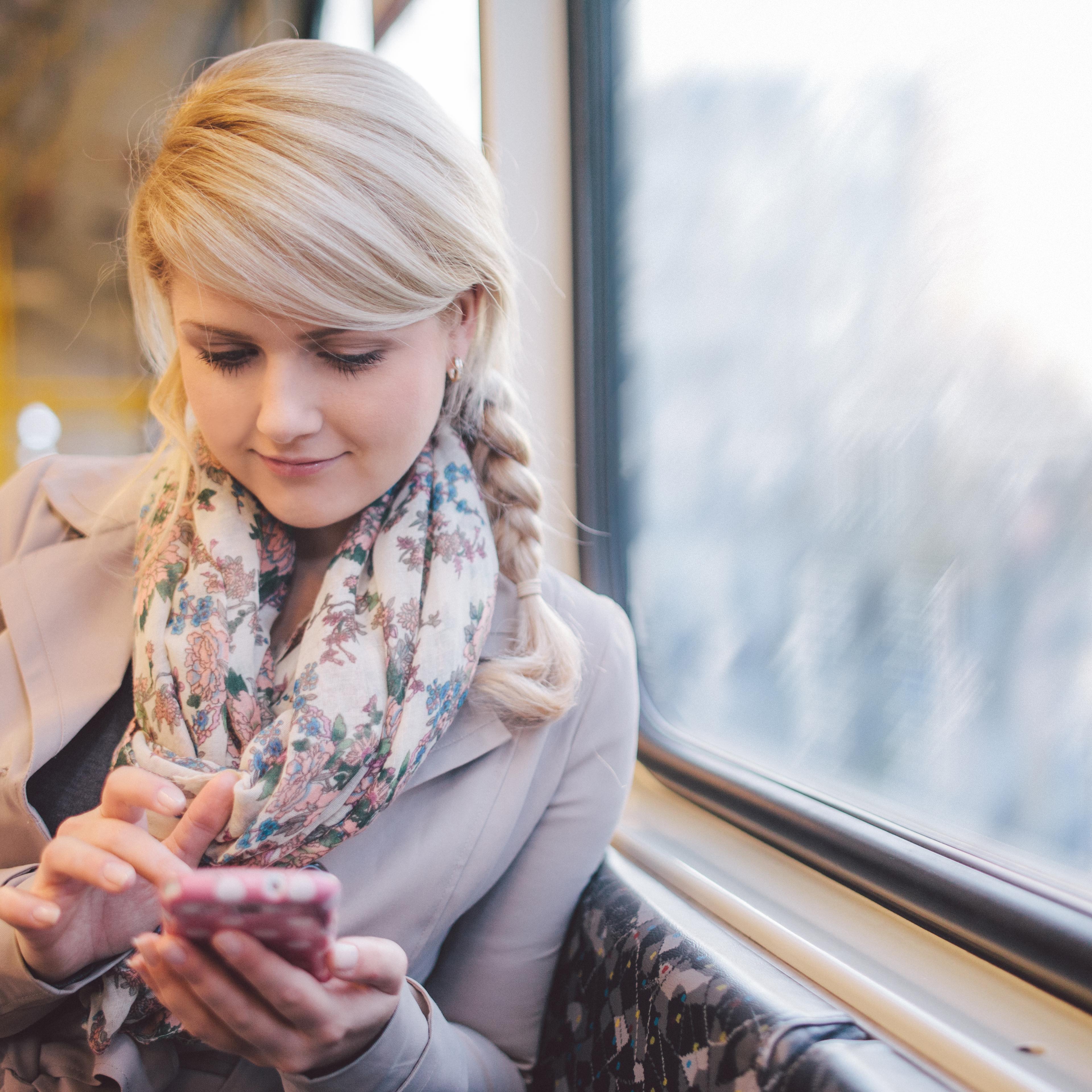 Woman using iPhone.