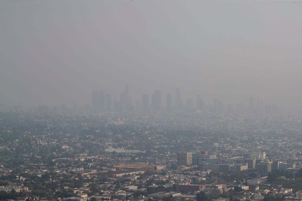 Wildfires are choking Californias skies with smoke, littering cities with ash, creating dangerous levels in regional air quality and transforming the sun at times into an ominous red orb.