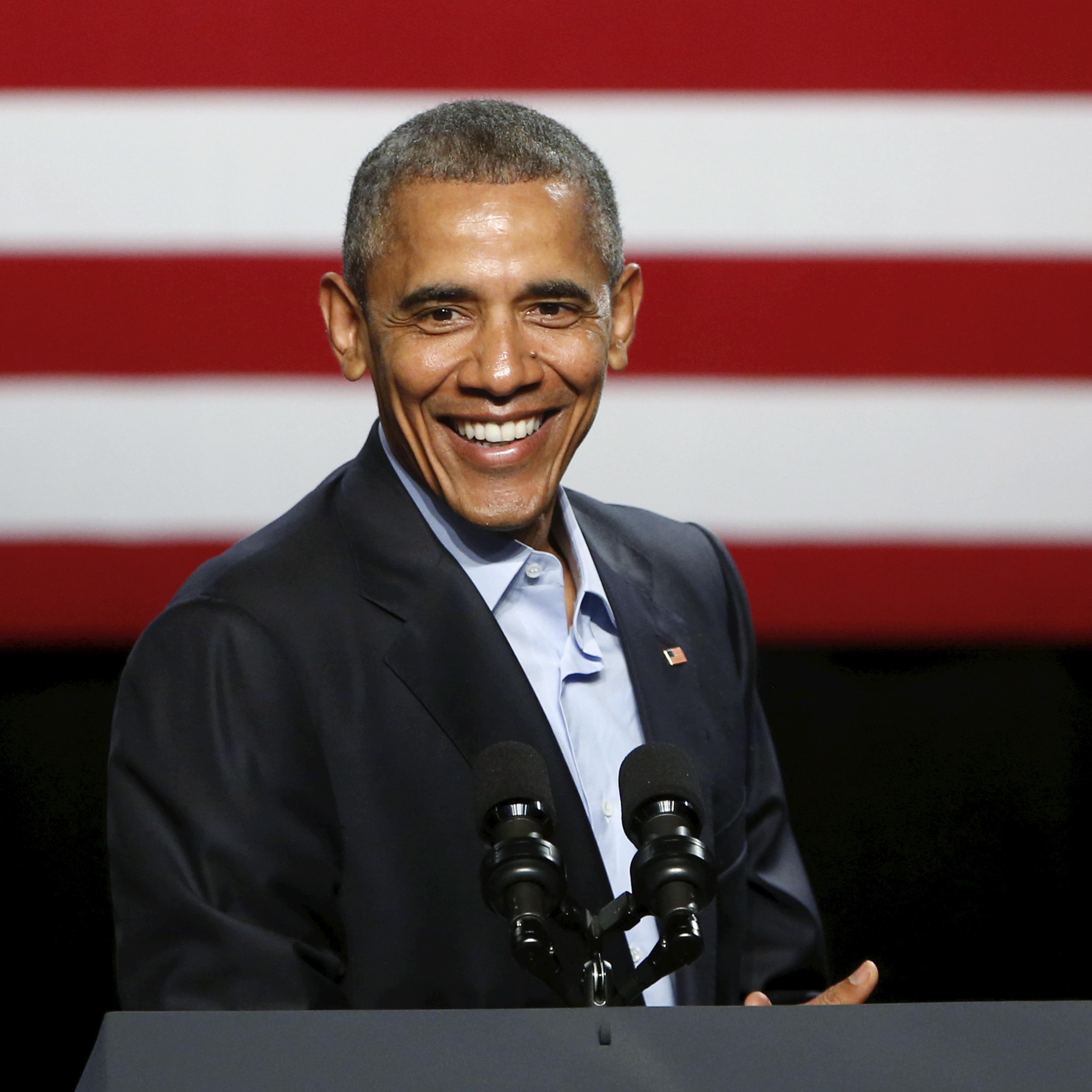 U.S. President Barack Obama laughs while he delivers remarks to supporters at a Democratic National Committee (DNC) event at Gilley's Club in Dallas, Texas on March 12, 2016.