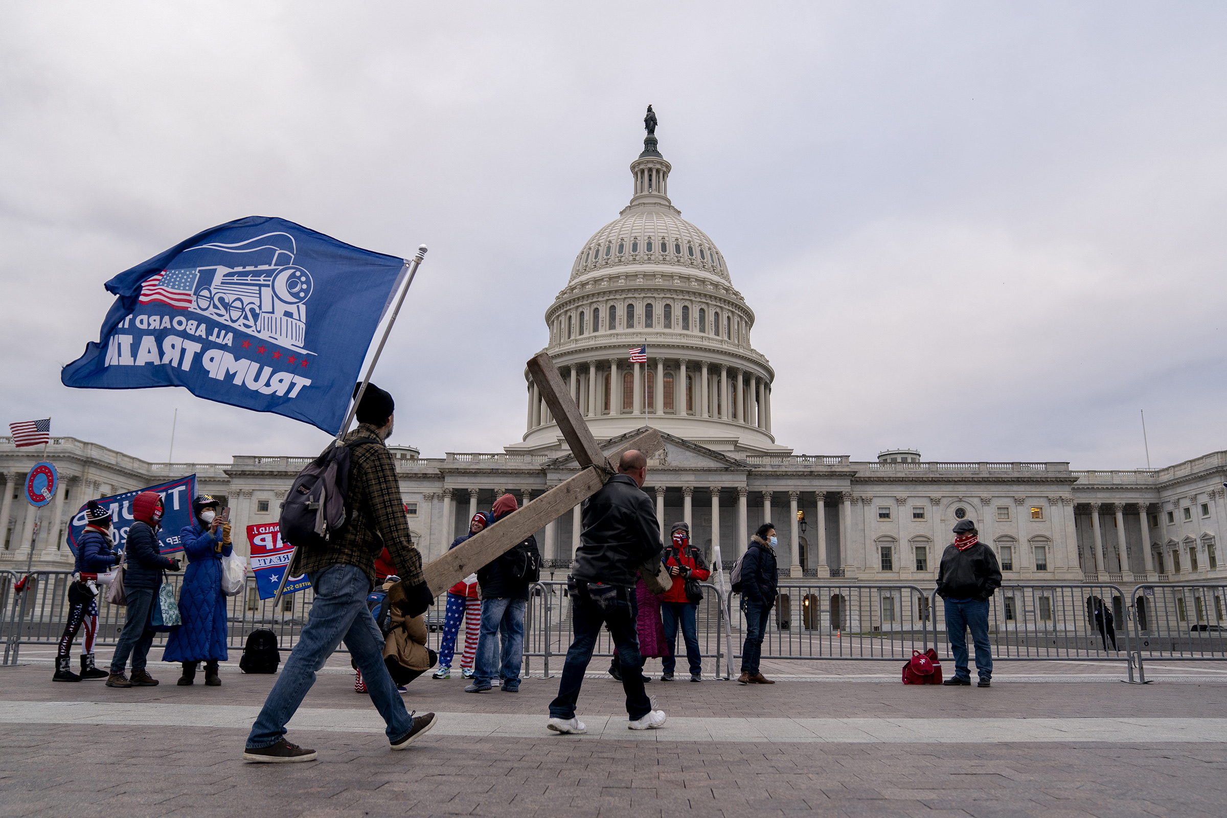 Demonstrators carry a cross to the U.S. Capitol on Jan. 6.