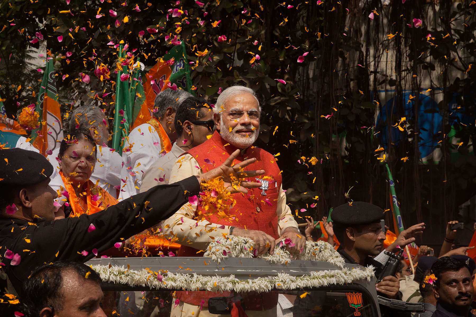 Bharatiya Janata Party leader Narendra Modi rides in an open jeep on his way to file nomination papers on April 9, 2014 in Vadodra, India