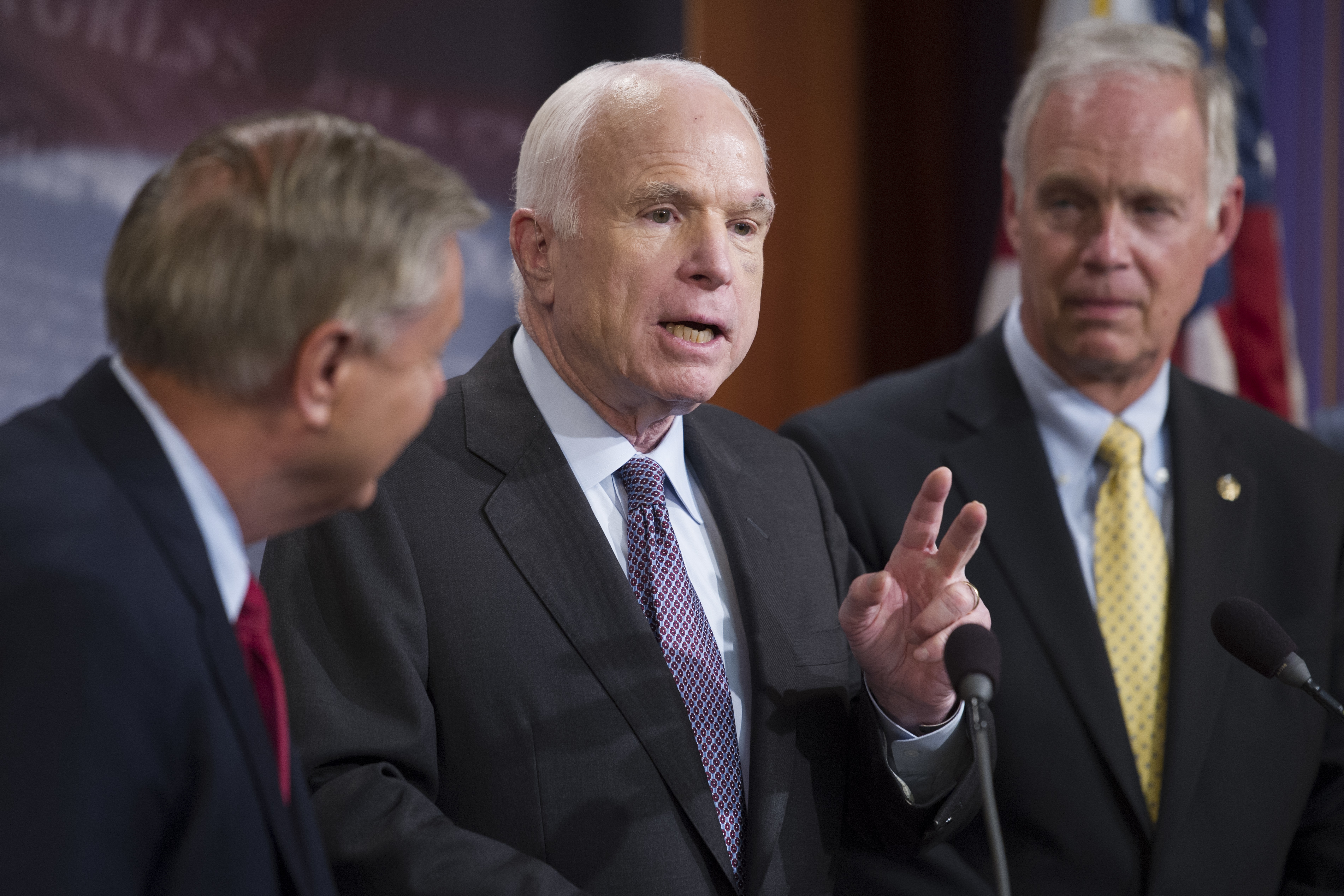 Sen. Lindsey Graham, R-S.C., Sen. John McCain, R-Ariz., and Sen. Ron Johnson, R-Wis., speak to reporters at the Capitol as the Republican-controlled Senate unable to fulfill their political promise to repeal and replace "Obamacare" because of opposition 