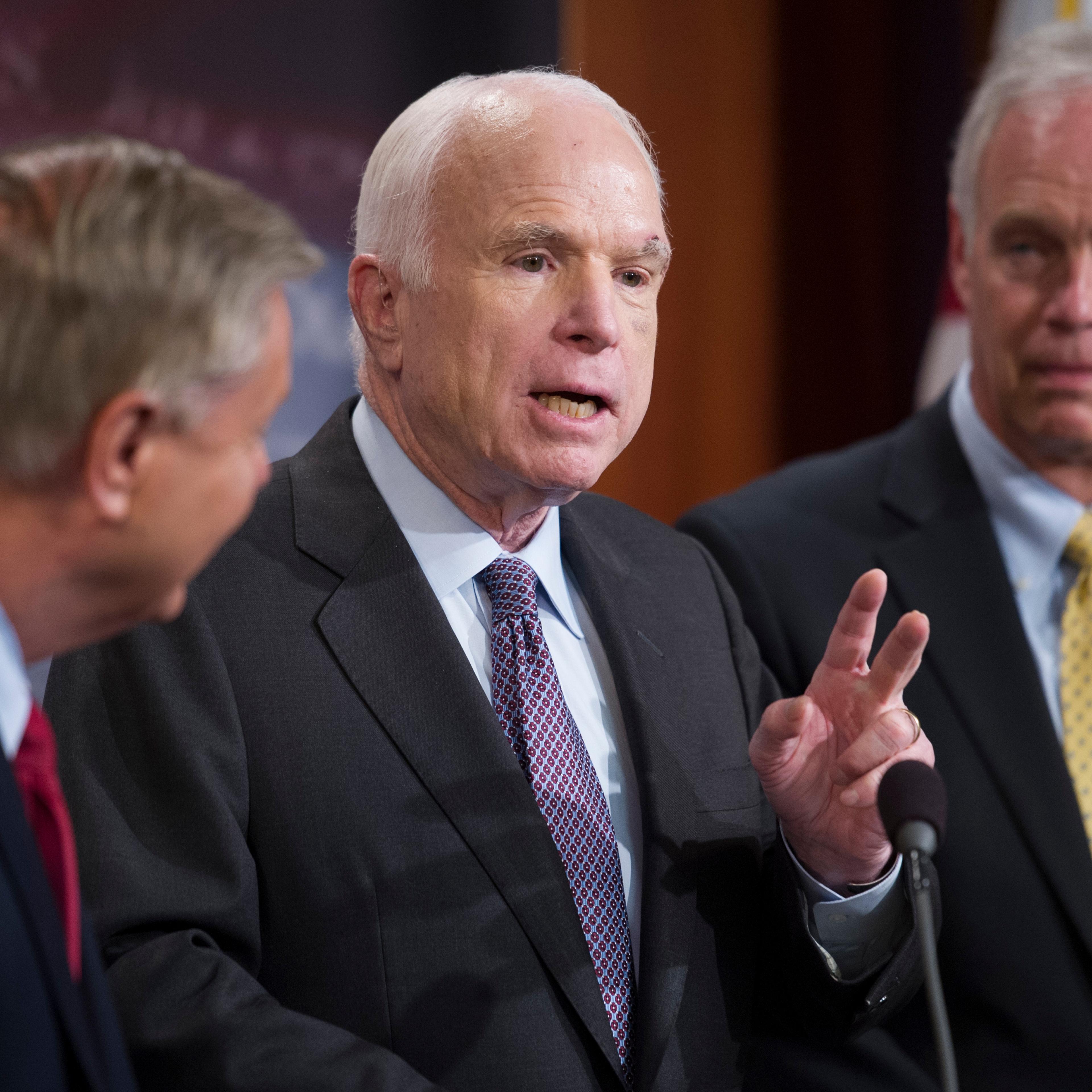 Sen. Lindsey Graham, R-S.C., Sen. John McCain, R-Ariz., and Sen. Ron Johnson, R-Wis., speak to reporters at the Capitol as the Republican-controlled Senate unable to fulfill their political promise to repeal and replace "Obamacare" because of opposition