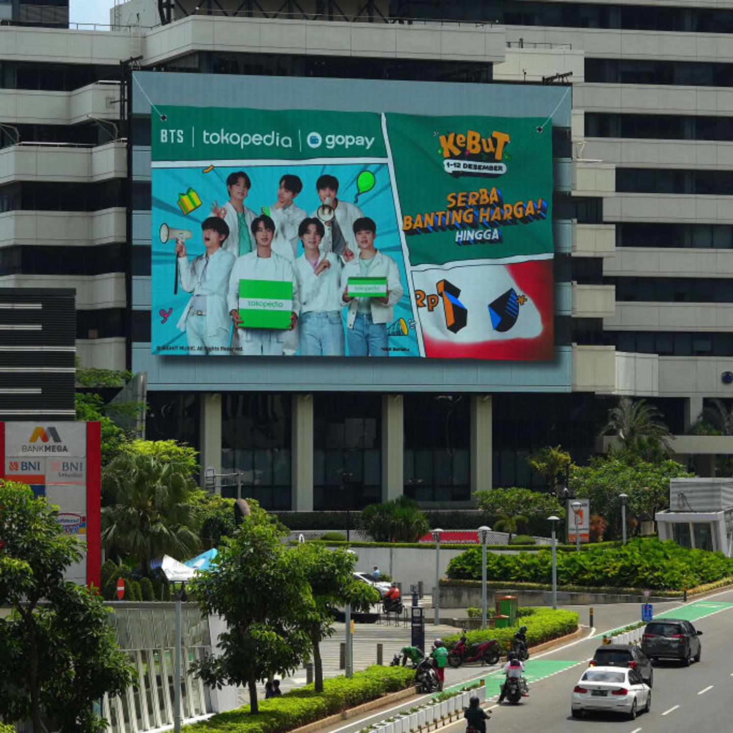 A digital advertisement for Tokopedia and Gopay featuring K-pop band BTS on a building in Jakarta, Indonesia, on Dec. 12, 2022