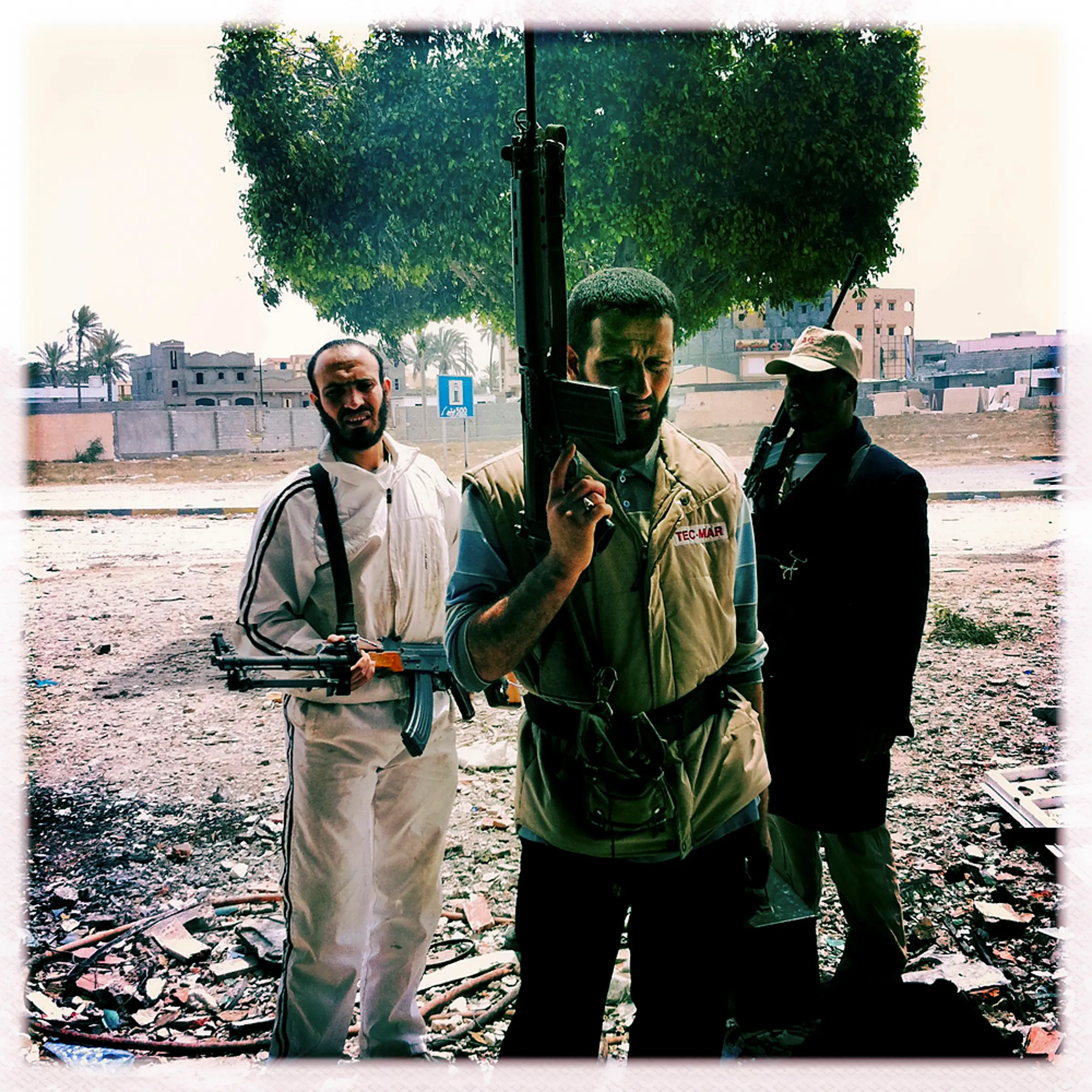 Opposition fighters wait to fight government soldiers in a building on Tripoli street, Misratah, April 20, 2011.