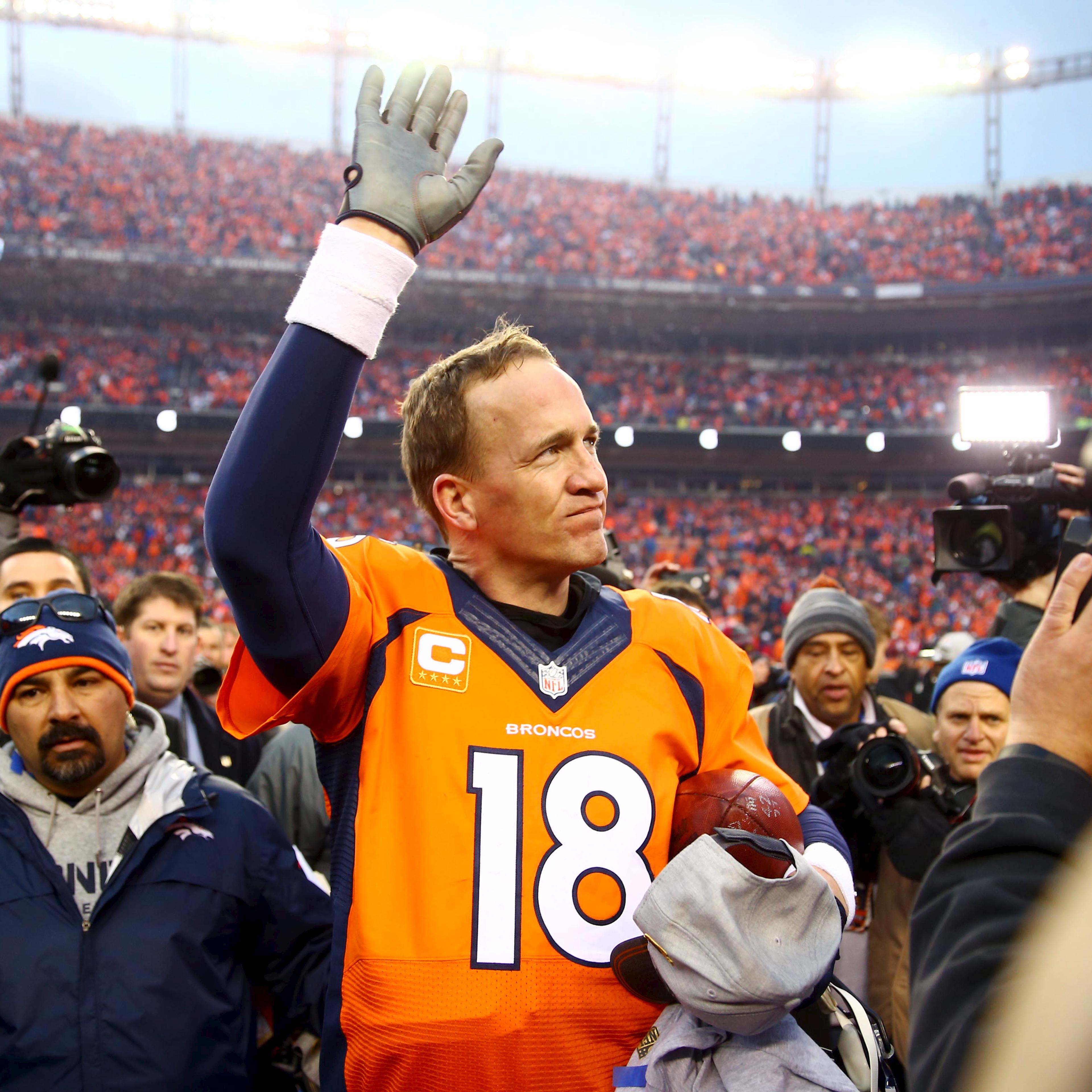 Denver Broncos quarterback Peyton Manning waves to the crowd after the AFC Championship football game against the New England Patriots at Sports Authority Field at Mile High in Denver, CO on Jan 24, 2016.
