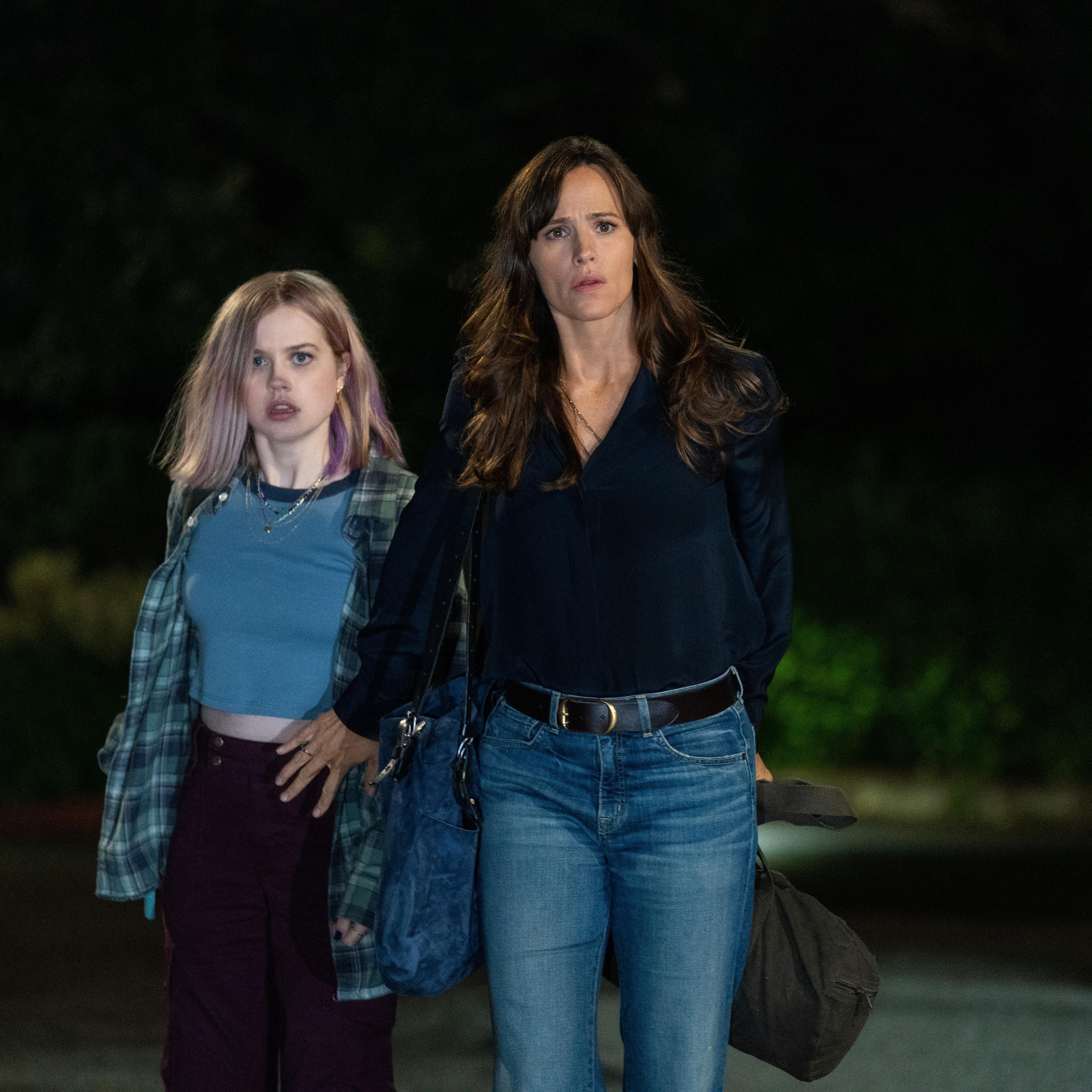 Hannah (Jennifer Garner) instinctively shields her stepdaughter, Bailey (Angourie Rice) from danger.