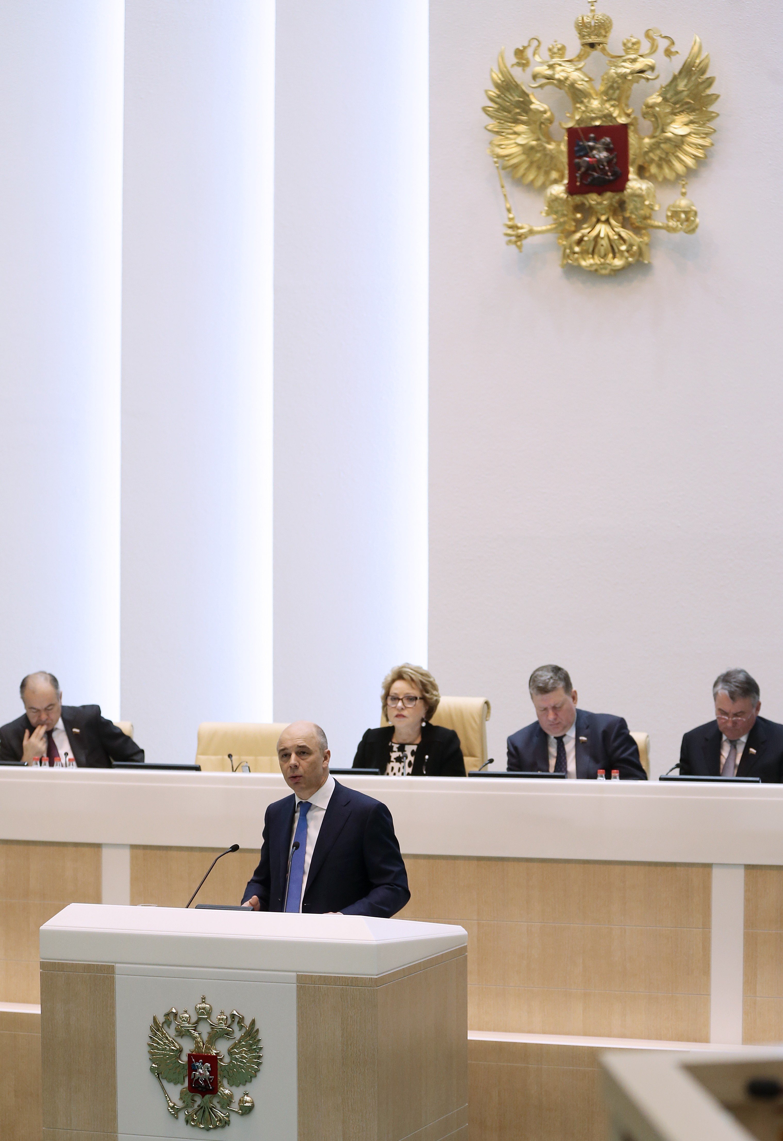 Russian Federation Council member Anton Siluanov delivers a speech as Russian Federation Council deputy chairman Ilyas Ukhmanov, Russian Federation Council chairperson Valentina Matviyenko, Russian Federation Council deputy chairmen Evgeny Bushmin and Yu