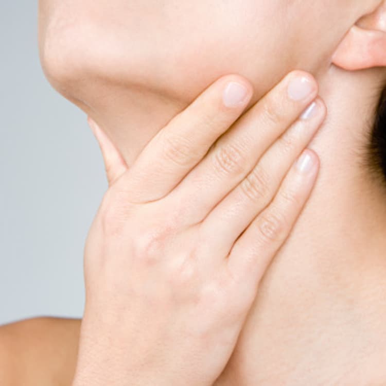 woman-hand-touching-throat