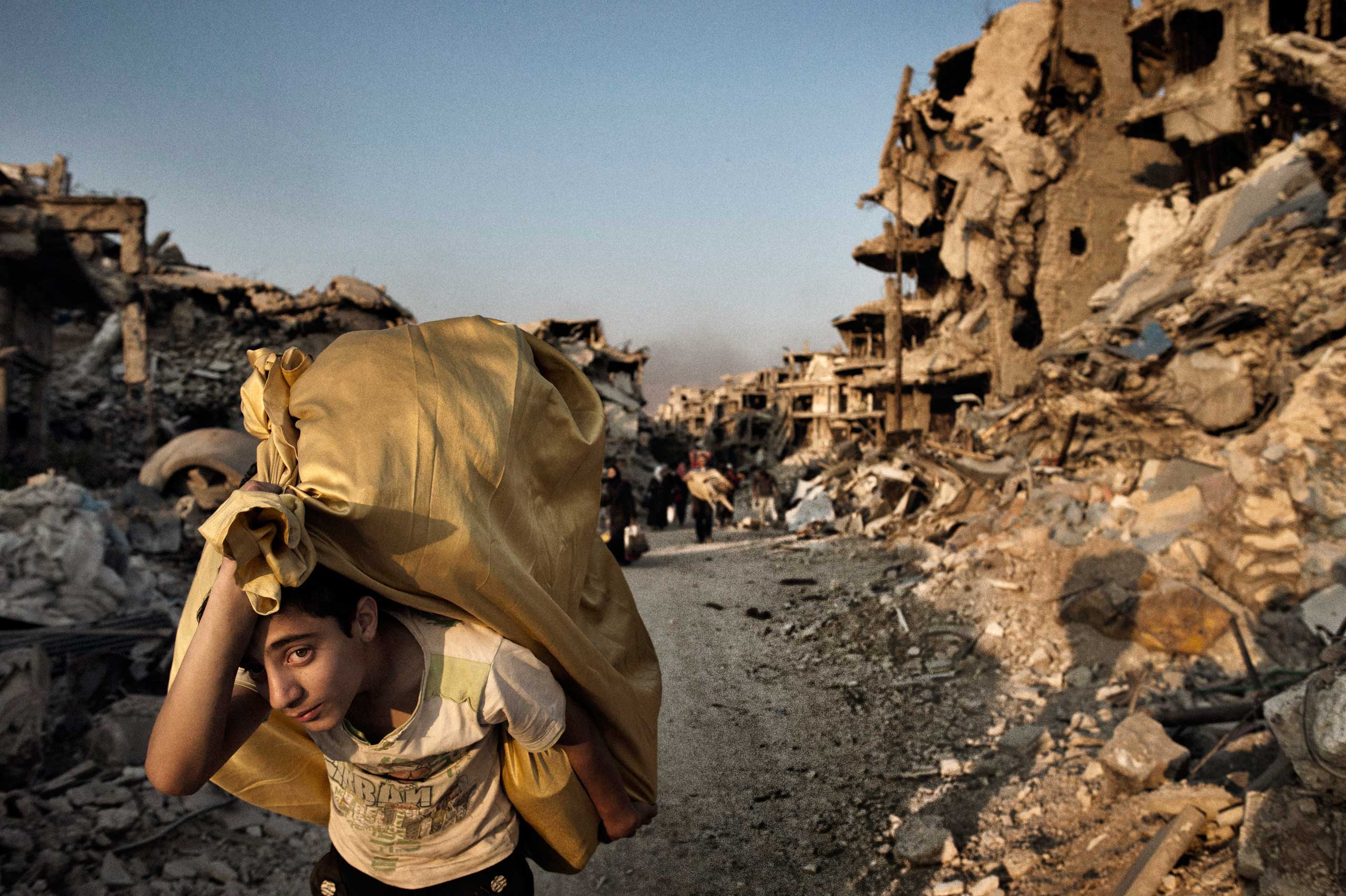 Homs Syria May 12 2014Residents return to devastated Homs to salvage what remainsThe people of central Homs came to salvage what remained of their belongings and homes after years of conflict and siege after government troops entered the neighborhoods as