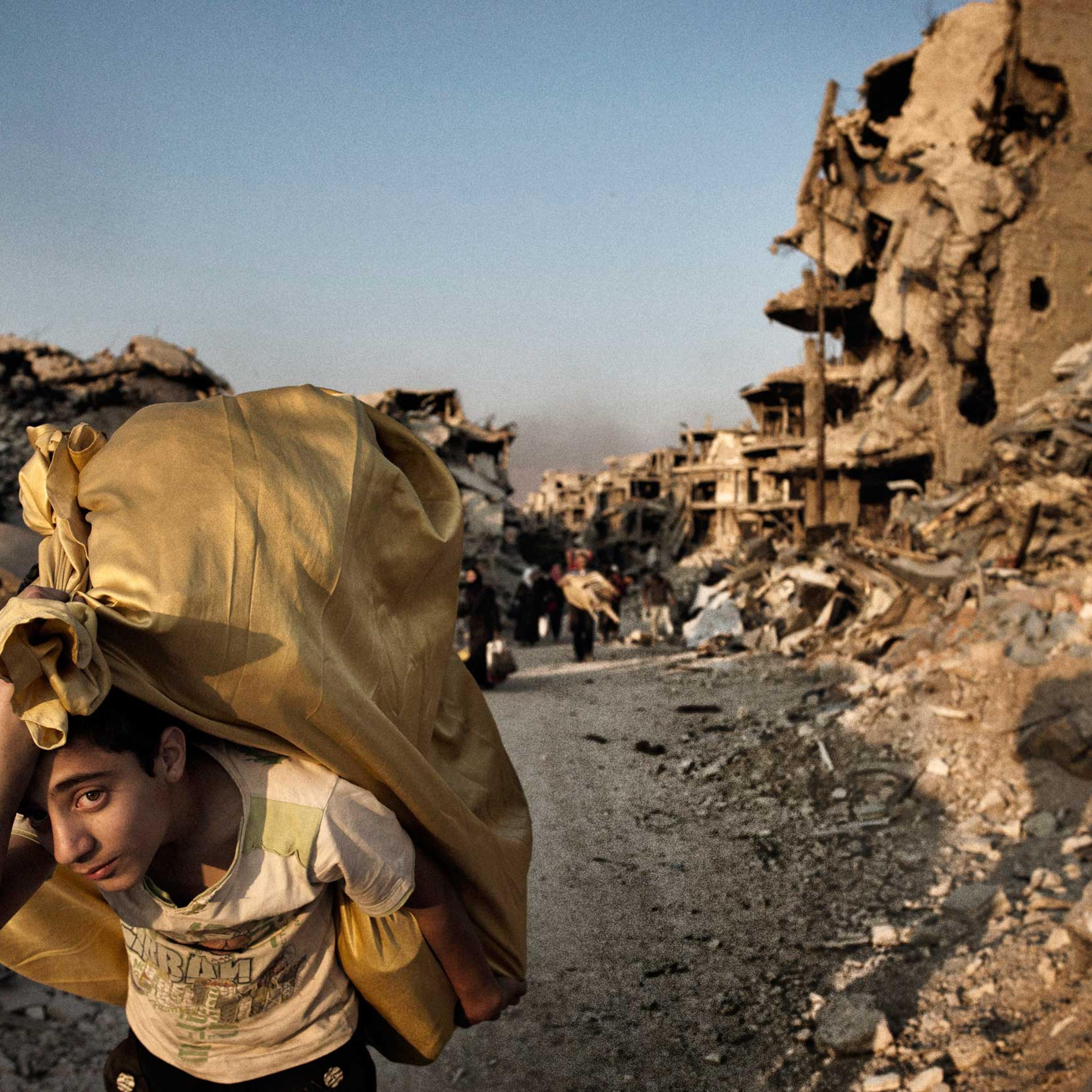 Homs Syria May 12 2014Residents return to devastated Homs to salvage what remainsThe people of central Homs came to salvage what remained of their belongings and homes after years of conflict and siege after government troops entered the neighborhoods as