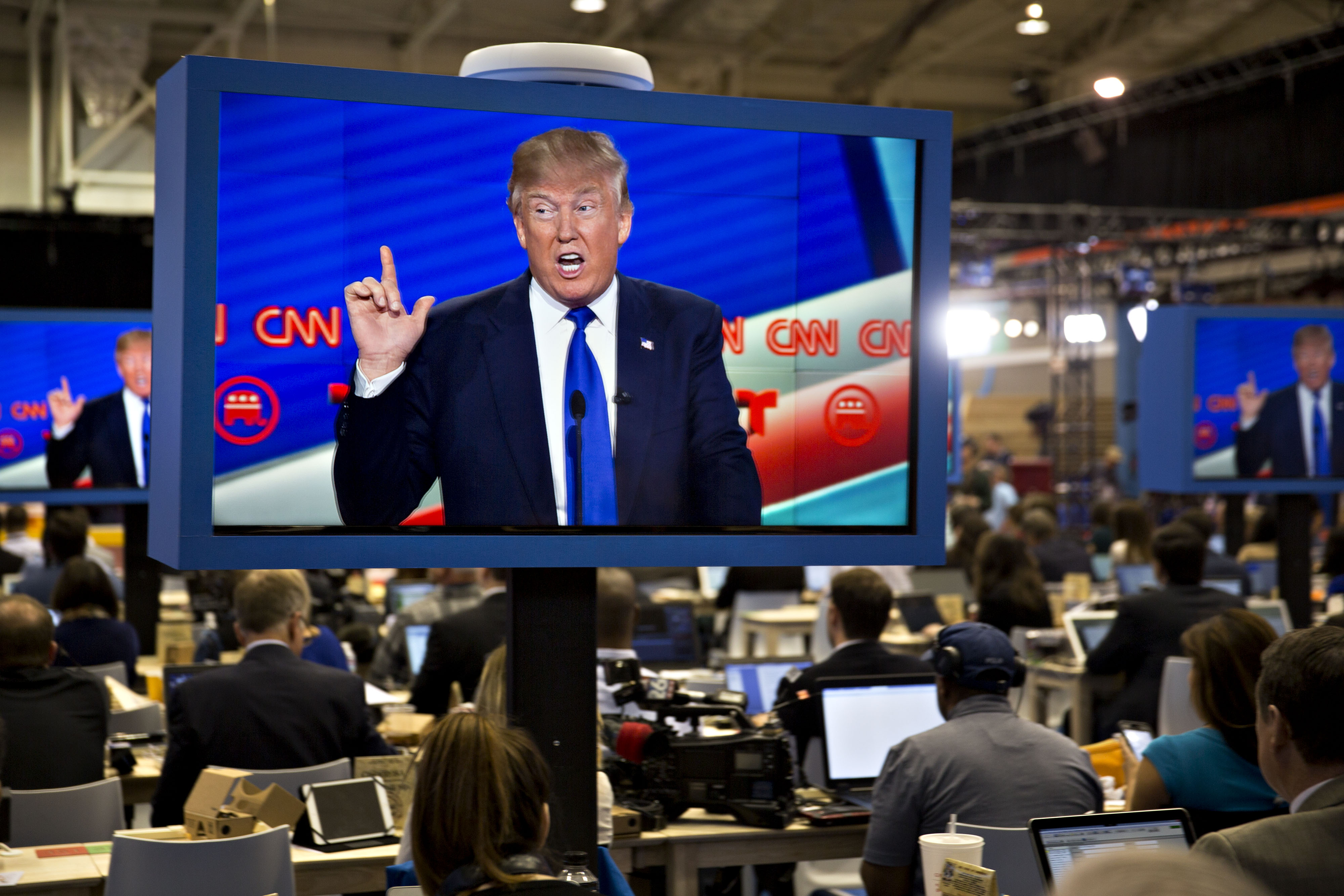 Donald Trump is seen speaking on a television screen in the filing center during the Republican presidential primary candidate debate sponsored by CNN and Telemundo at the University of Houston in Houston on Feb. 25, 2016.