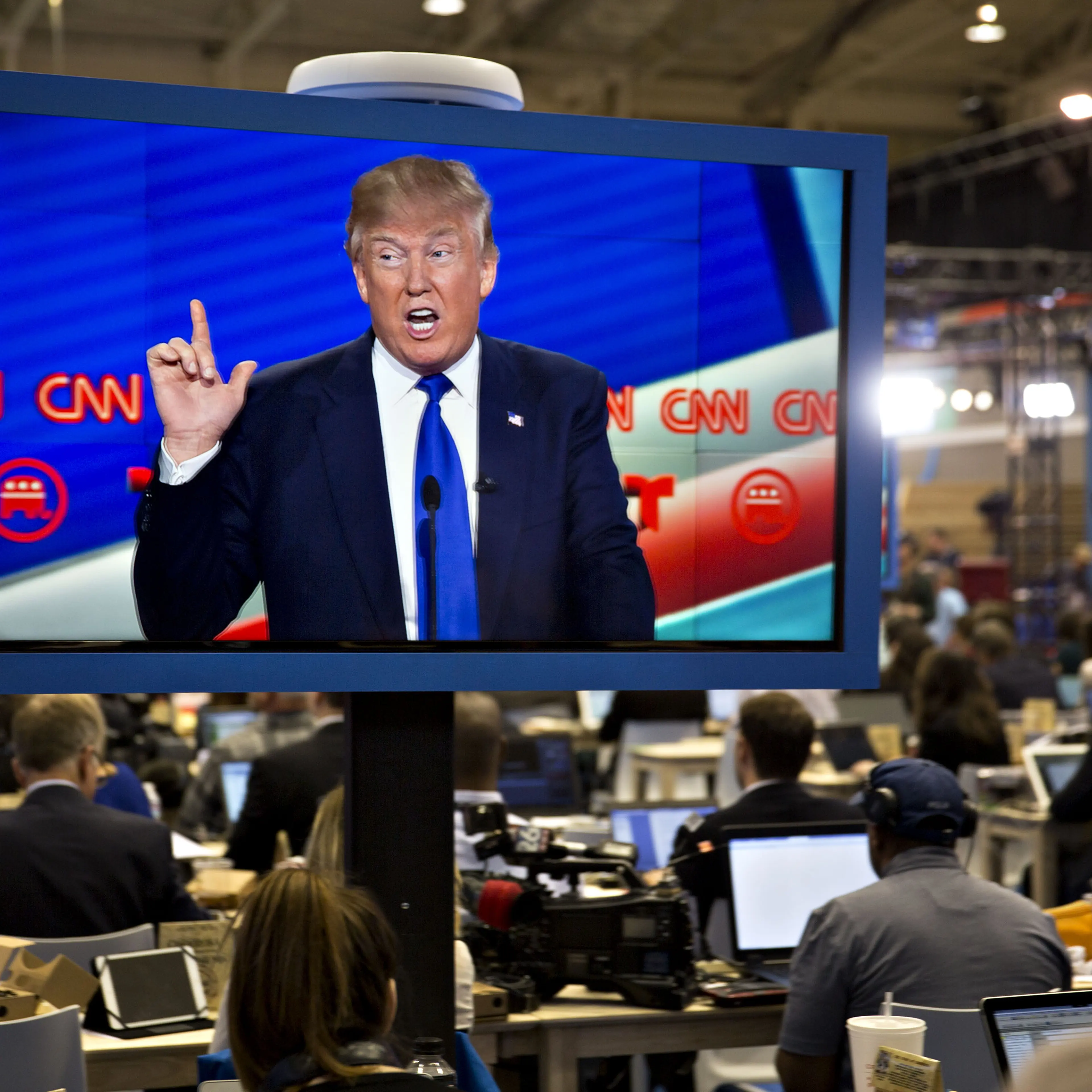 Donald Trump is seen speaking on a television screen in the filing center during the Republican presidential primary candidate debate sponsored by CNN and Telemundo at the University of Houston in Houston on Feb. 25, 2016.