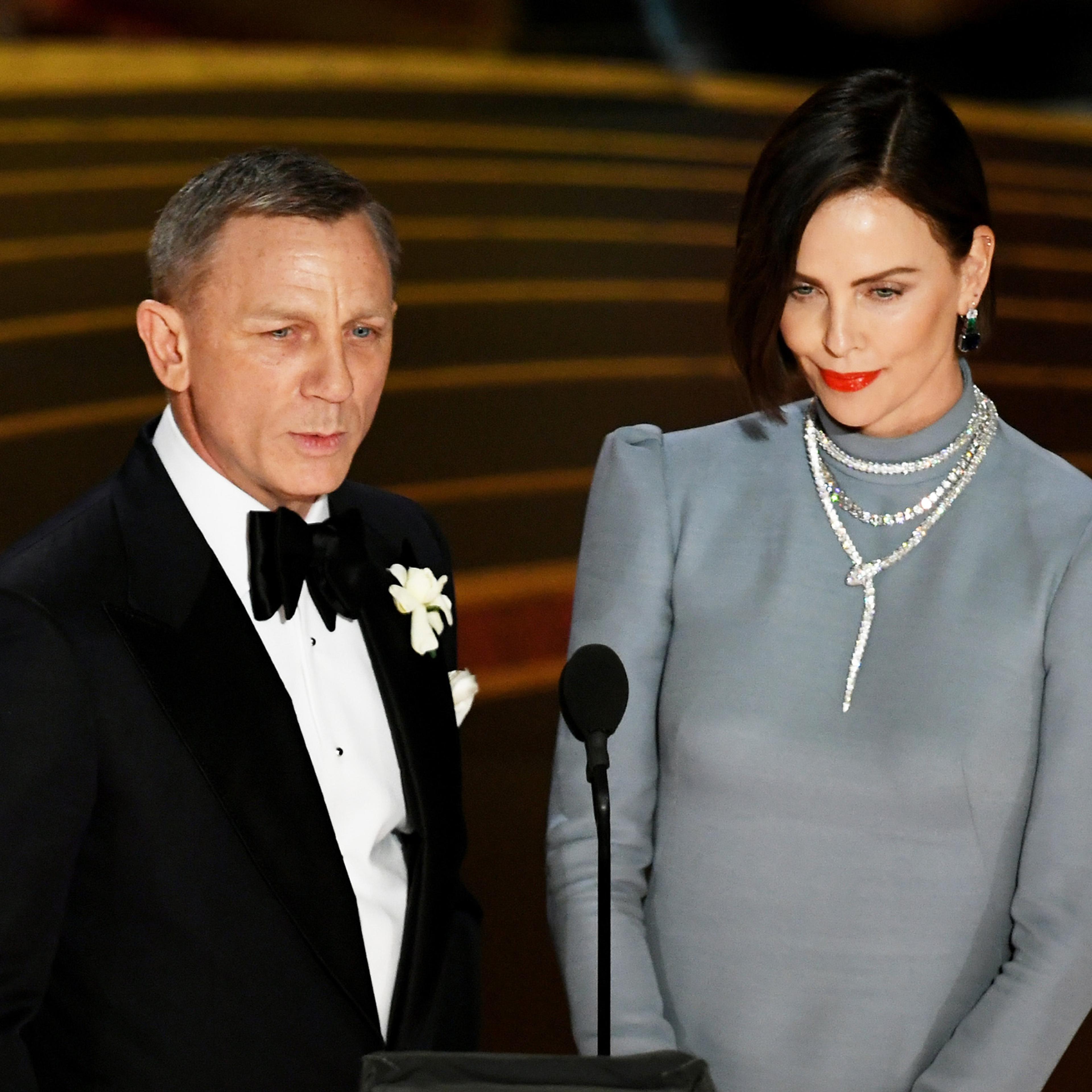 Daniel Craig and Charlize Theron speak onstage during the 91st Annual Academy Awards at Dolby Theatre on Feb. 24, 2019.