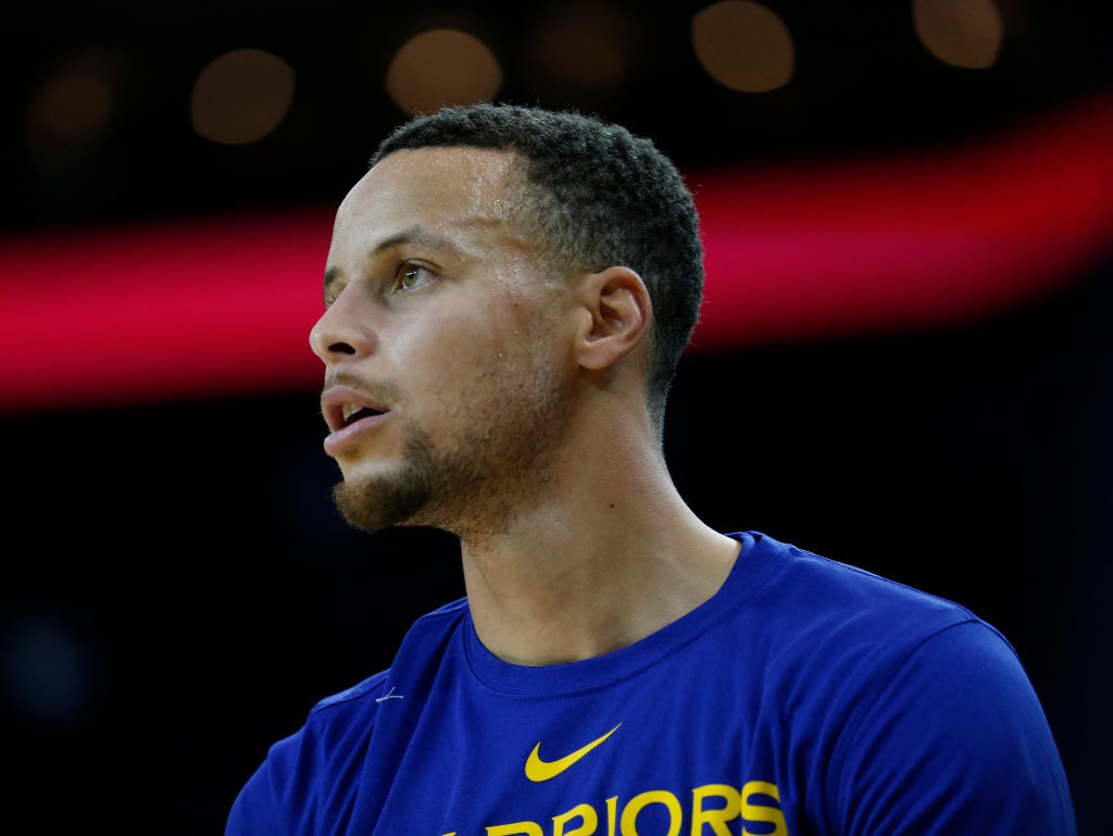 Golden State Warriors Stephen Curry warms up before playing Orlando Magic team