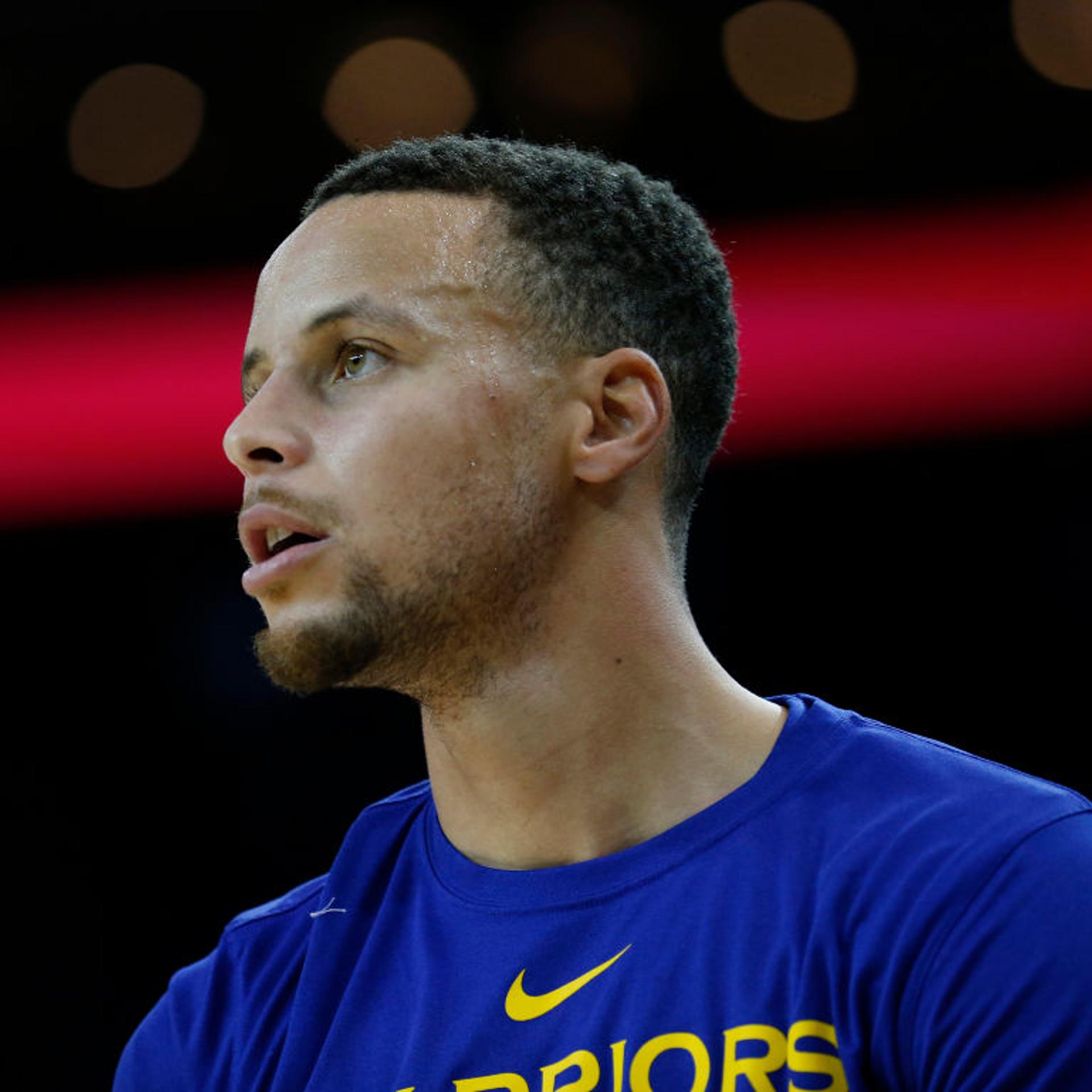 Golden State Warriors Stephen Curry warms up before playing Orlando Magic team