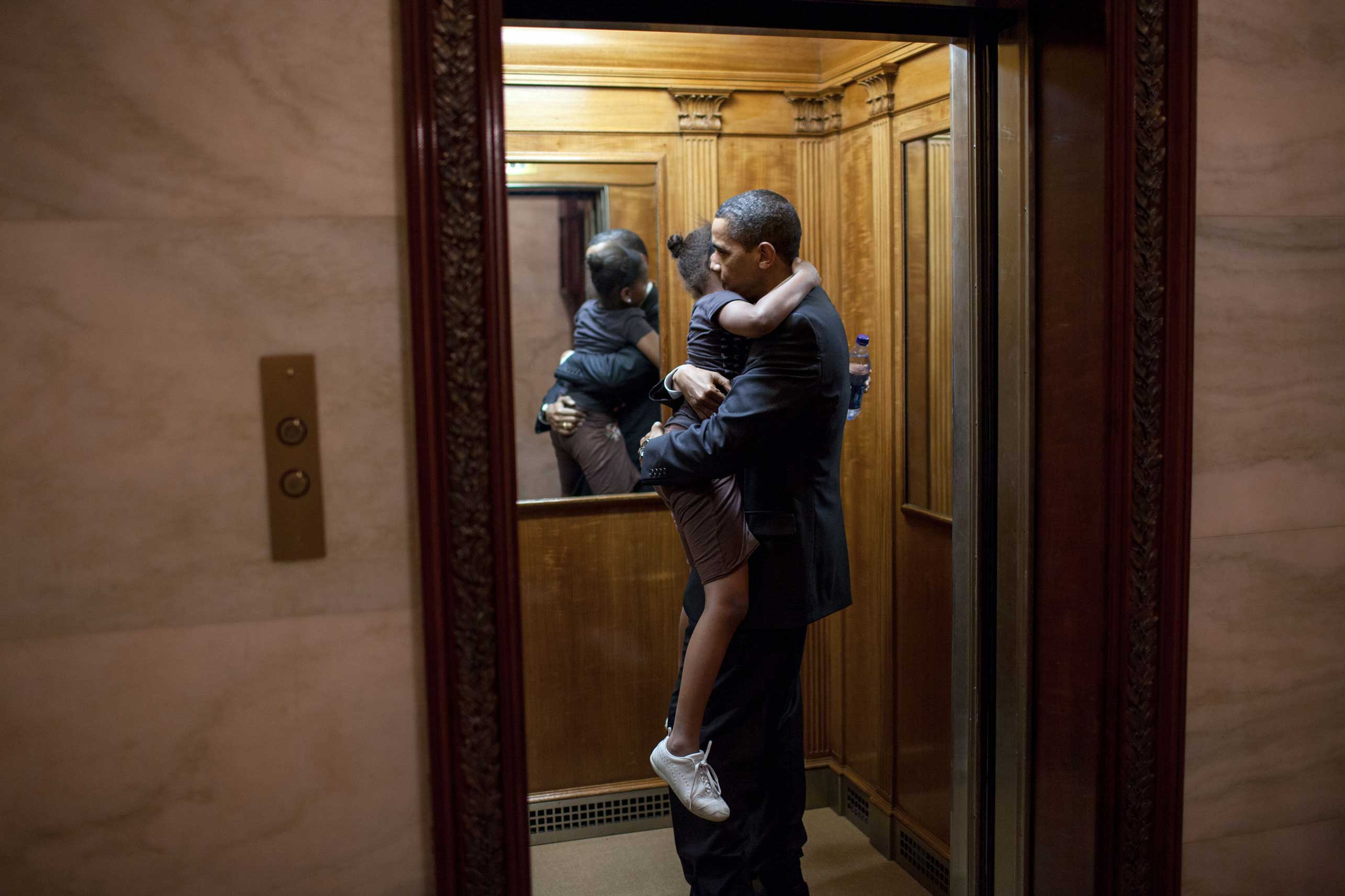 President Barack Obama was leaving the State Floor after an event and found Sasha in the elevator ready to head upstairs to the private residence. He decided to ride upstairs with her before returning to the Oval Office, May 19, 2009. (Official White Hou