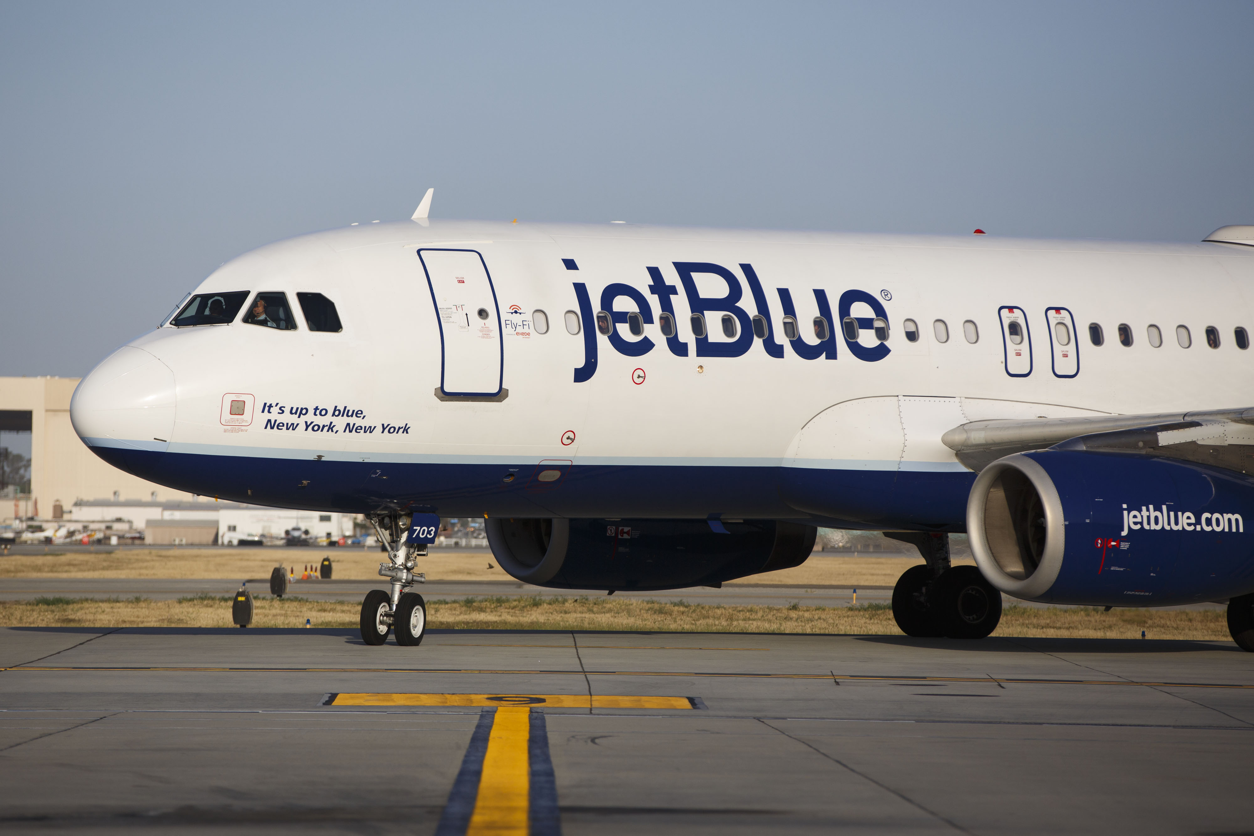 A JetBlue Airways Corp. Airbus Group SE A320 aircraft taxis to the gate on the tarmac at Long Beach Airport in Long Beach, California, on April 25, 2016.