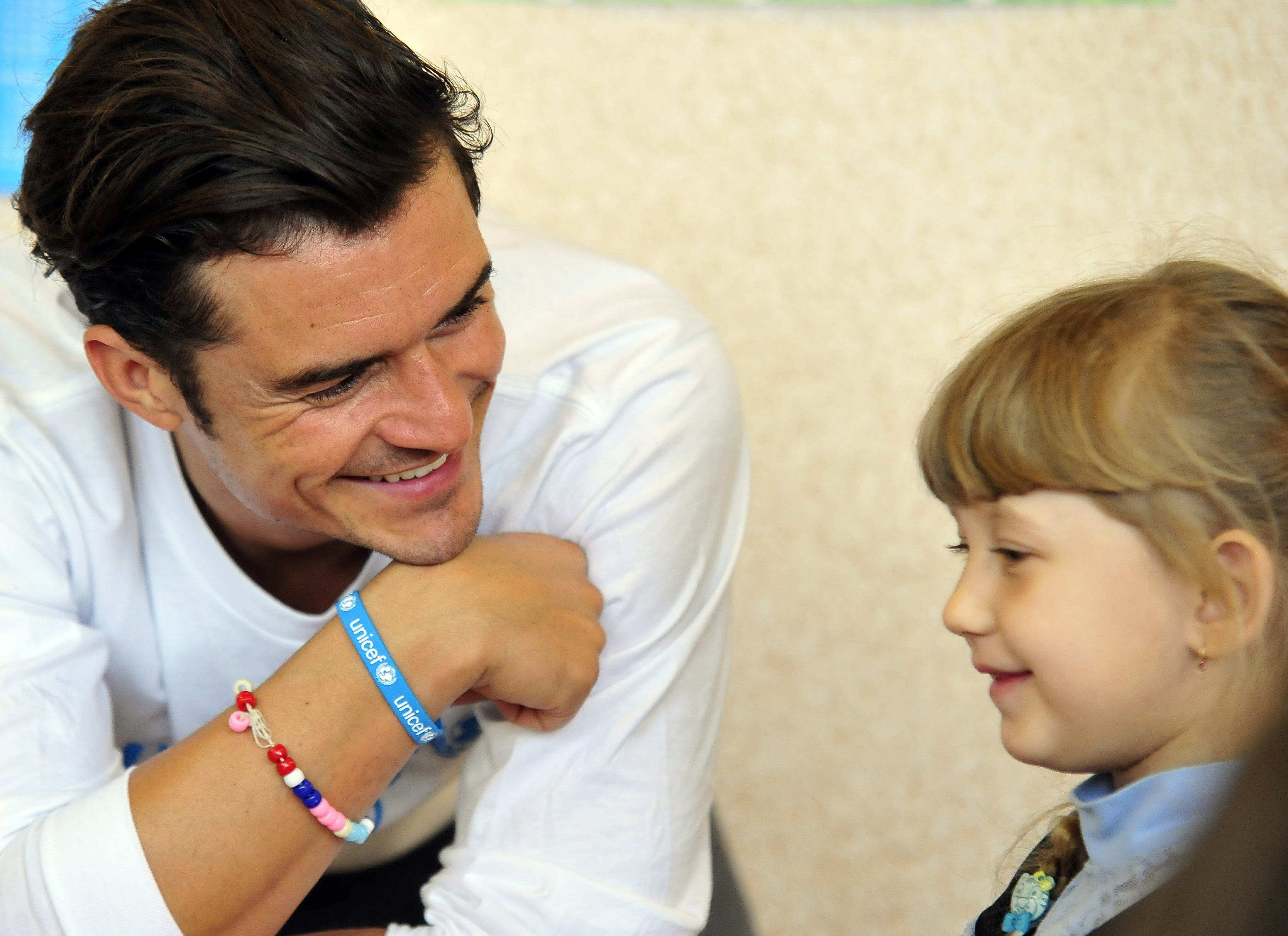Orlando Bloom plays with pupils of a school in Slovyansk, Ukraine on April 27, 2016.