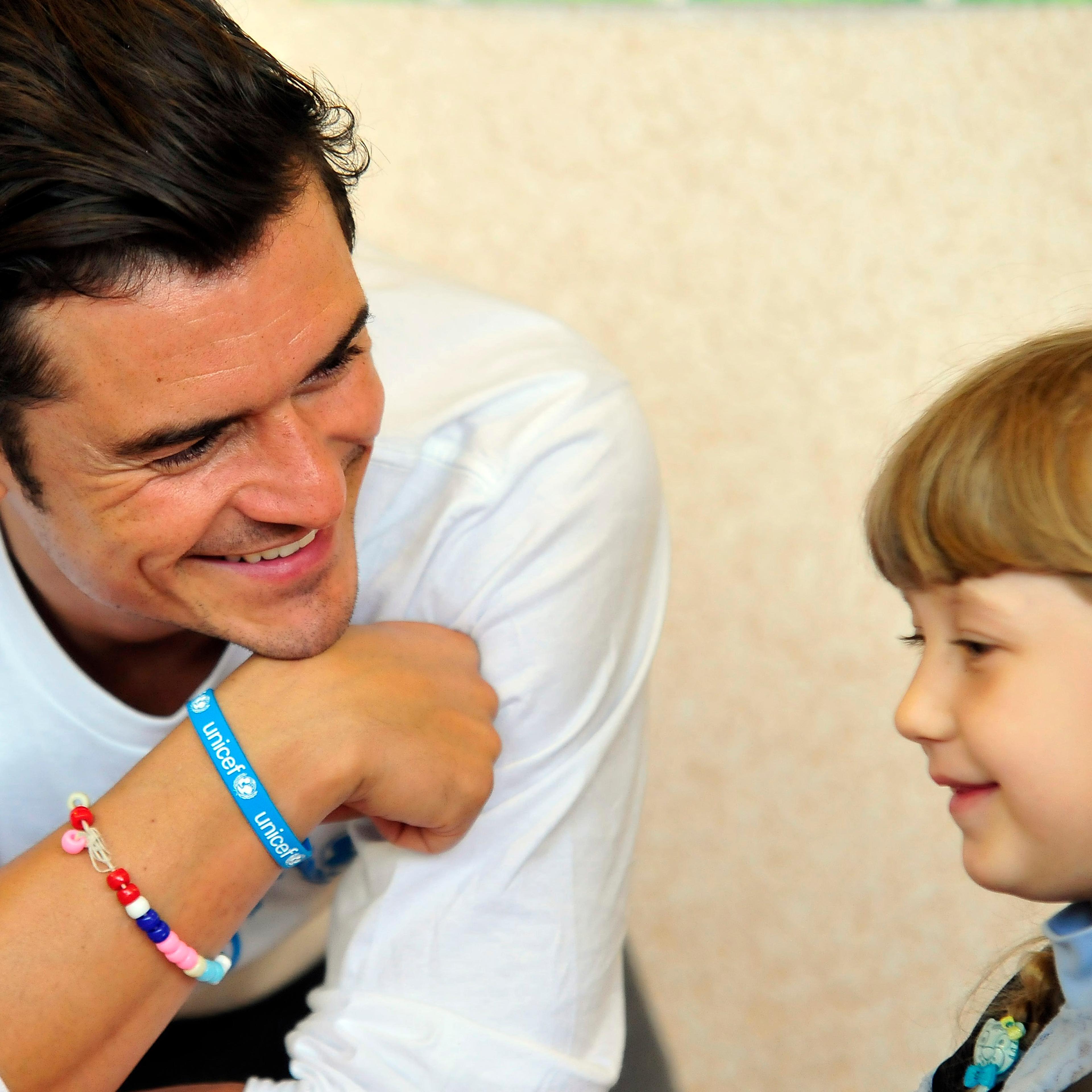 Orlando Bloom plays with pupils of a school in Slovyansk, Ukraine on April 27, 2016.