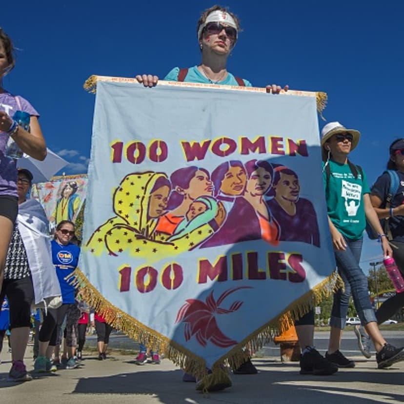 Participants in the "100 Women-100 Mile Pilgrimage" walk on a road after a lunch break on their trek, after stopping at the University Maryland Baltimore County on Sep. 20, 2015.