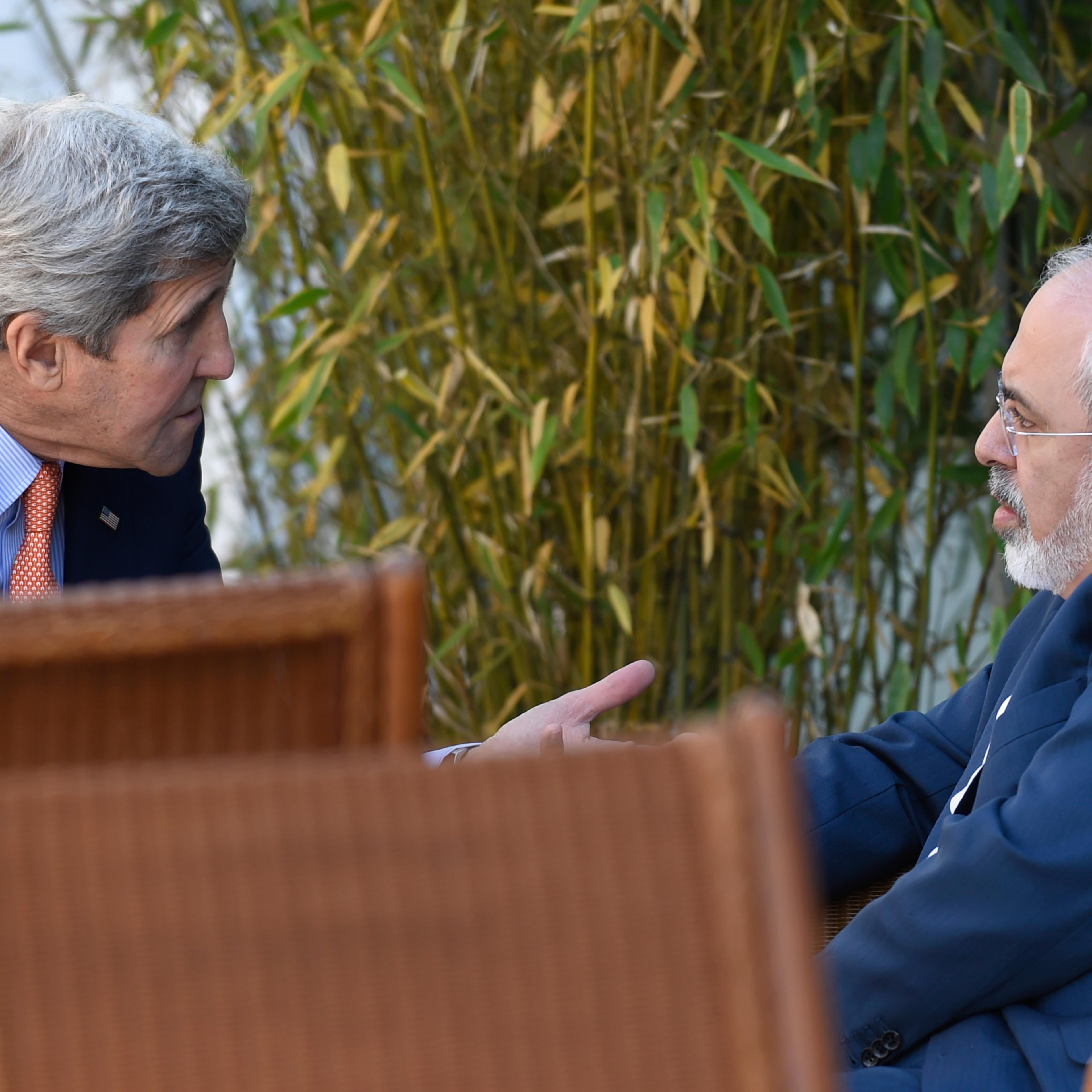 U.S. Secretary of State John Kerry (L) talks with Iranian Foreign Minister Mohammad Javad Zarif, in Geneva, Switzerland on May 30, 2015.