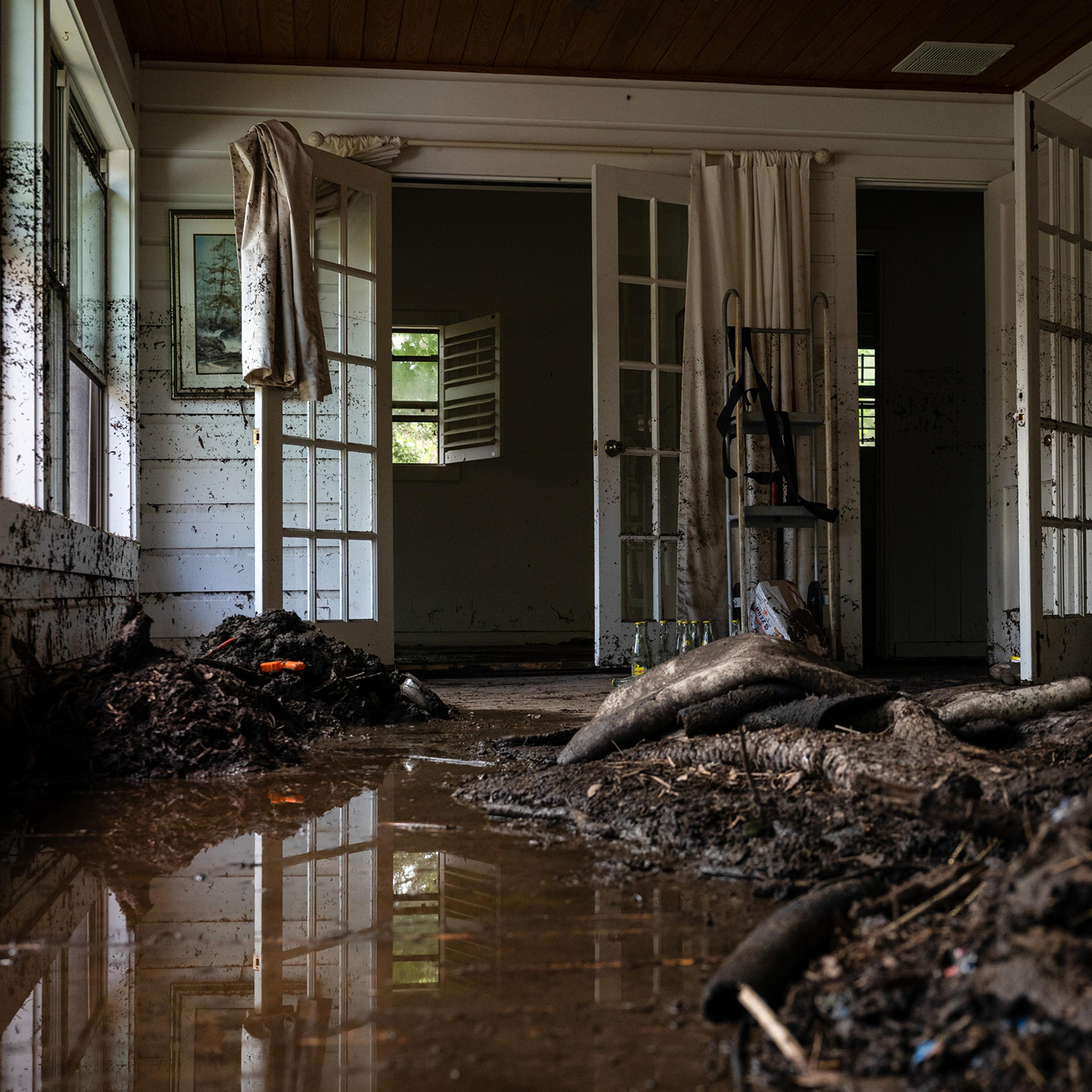 Debris and water in a sunroom of a home following the flood in Hunt, Texas on July 9, 2025.