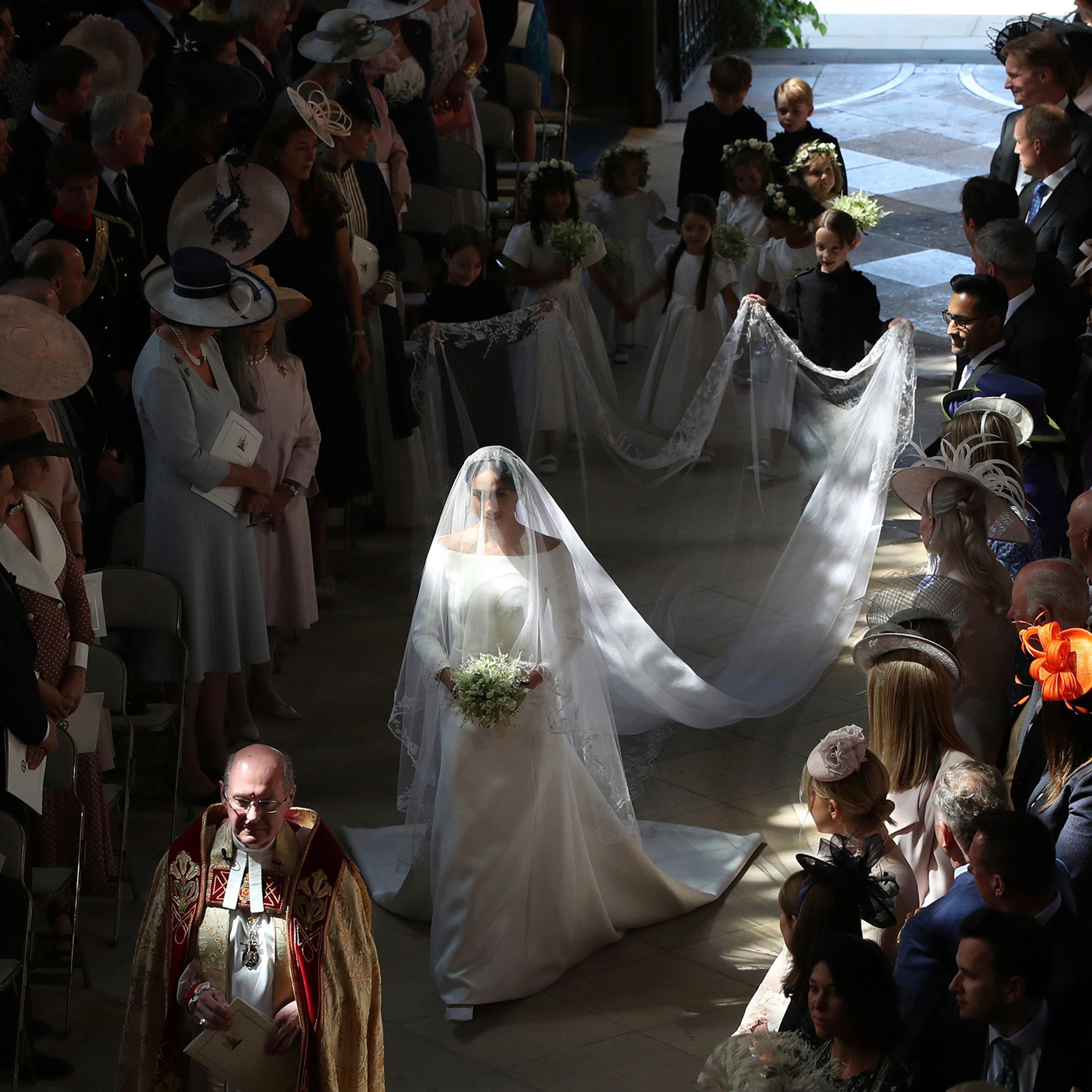 Meghan Markle walks down the aisle at St. George's Chapel in Windsor Castle in Windsor, May 19, 2018.