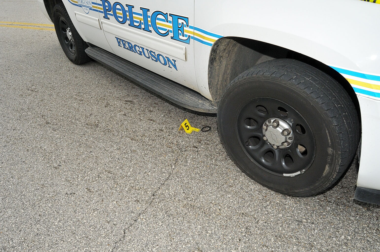 An undated evidence photograph made available by the St. Louis County prosecutors office on Nov. 25, 2014 shows Ferguson police officer Darren Wilson's vehicle and a bracelet taken after the shooting of Michael Brown.