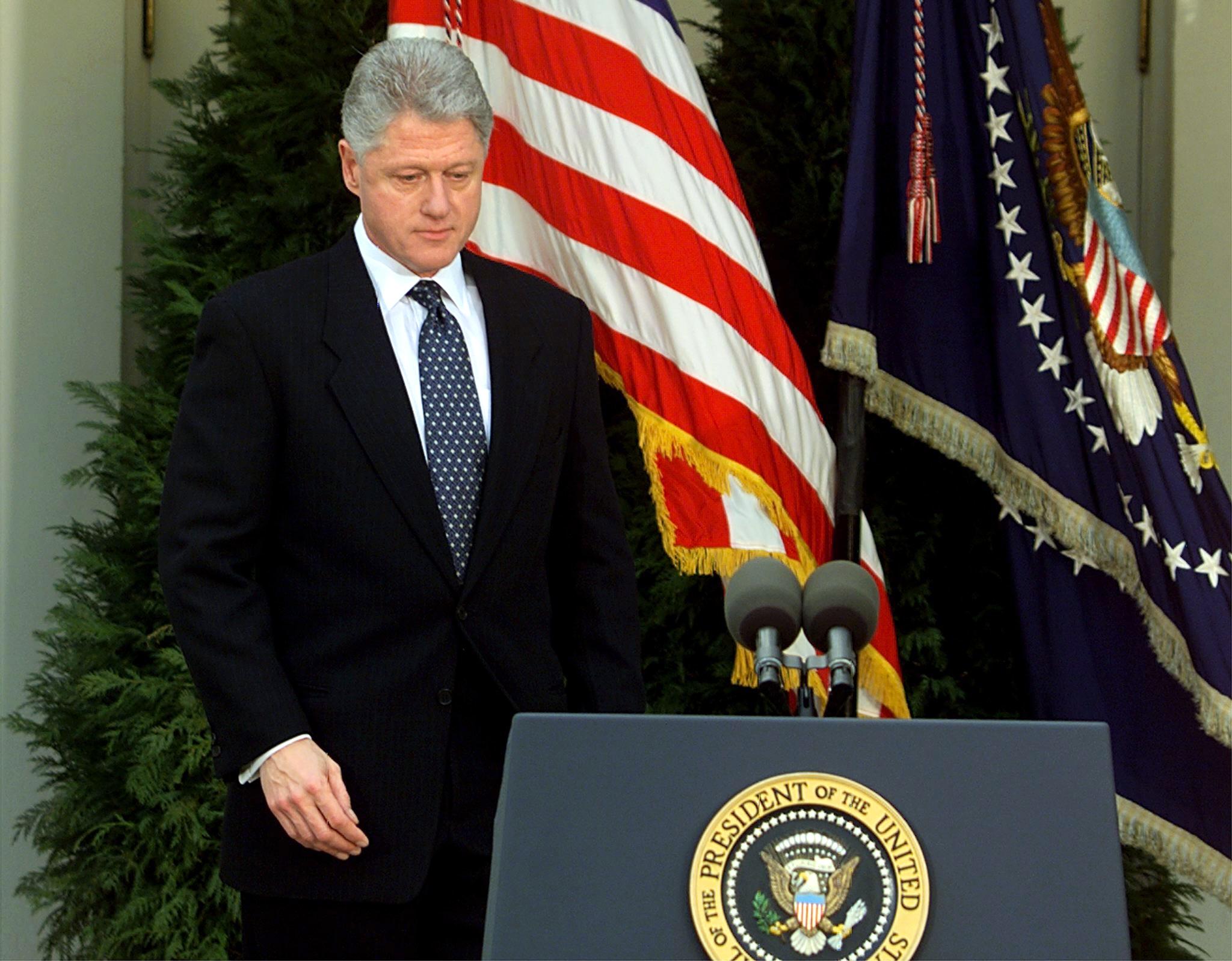 US President Bill Clinton walks to the podium mome