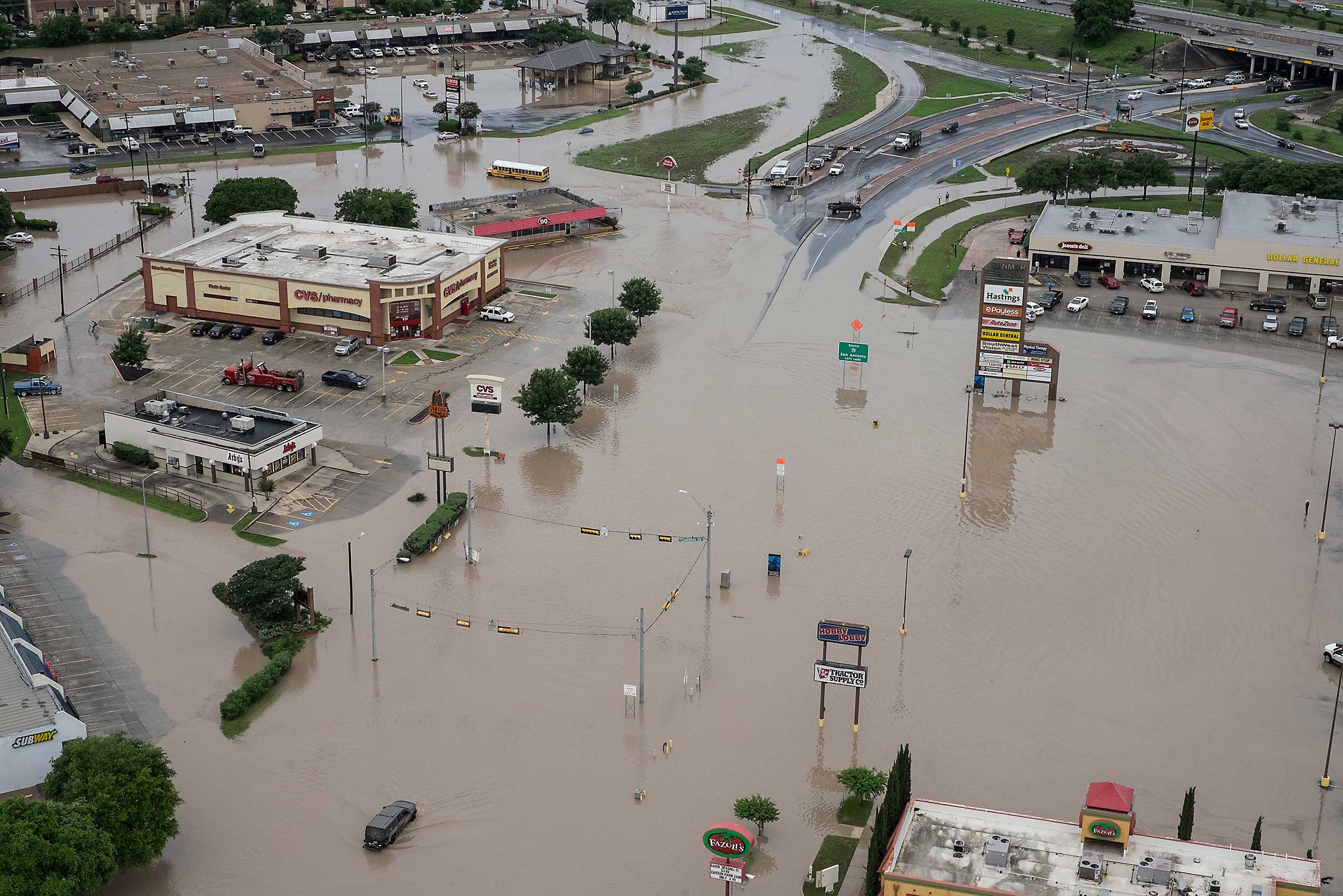A shopping center located at Texas 80 near I-35 has high water in the parking lots from the Blanco River flooding in San Marcos,Texas, on May 24, 2015.