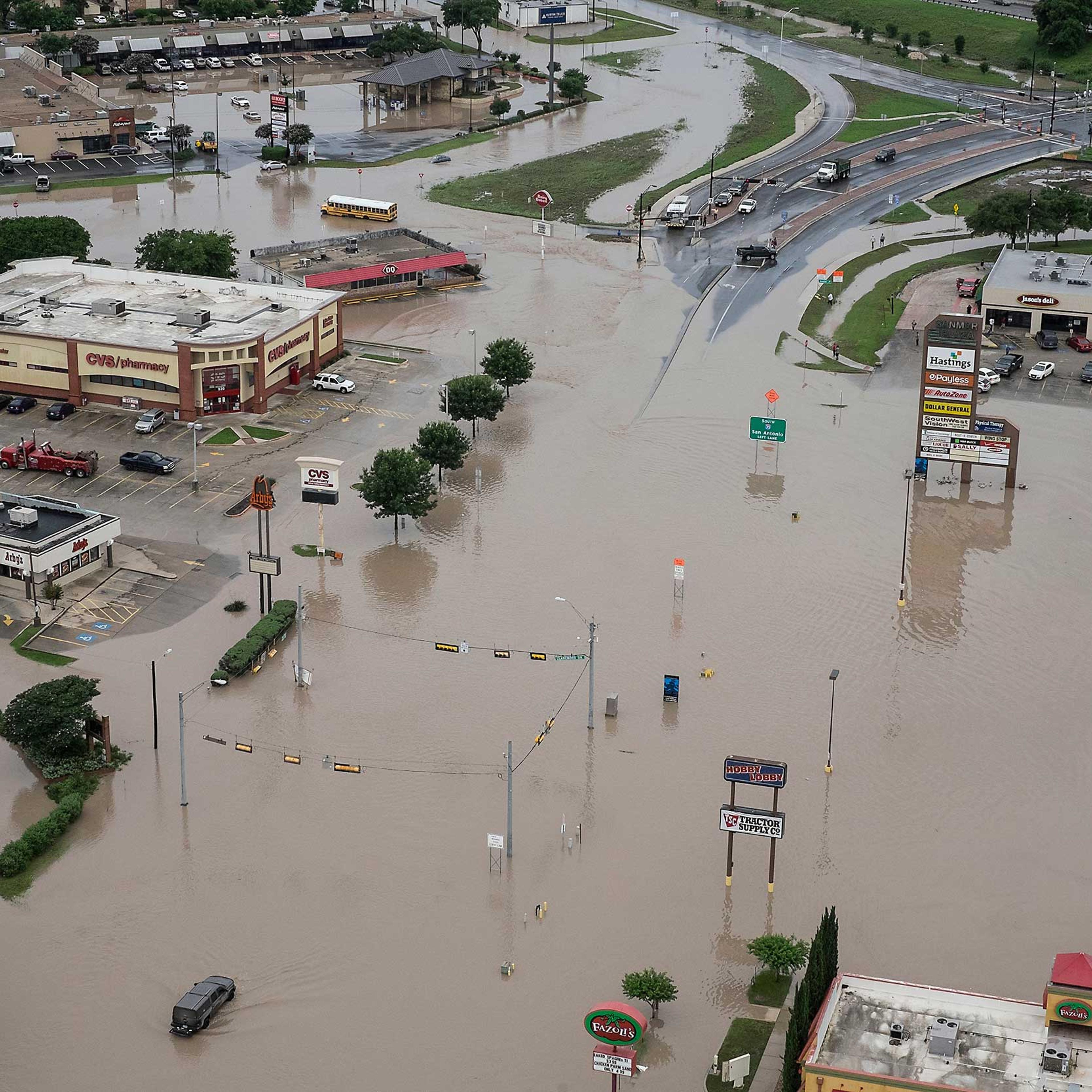 A shopping center located at Texas 80 near I-35 has high water in the parking lots from the Blanco River flooding in San Marcos,Texas, on May 24, 2015.