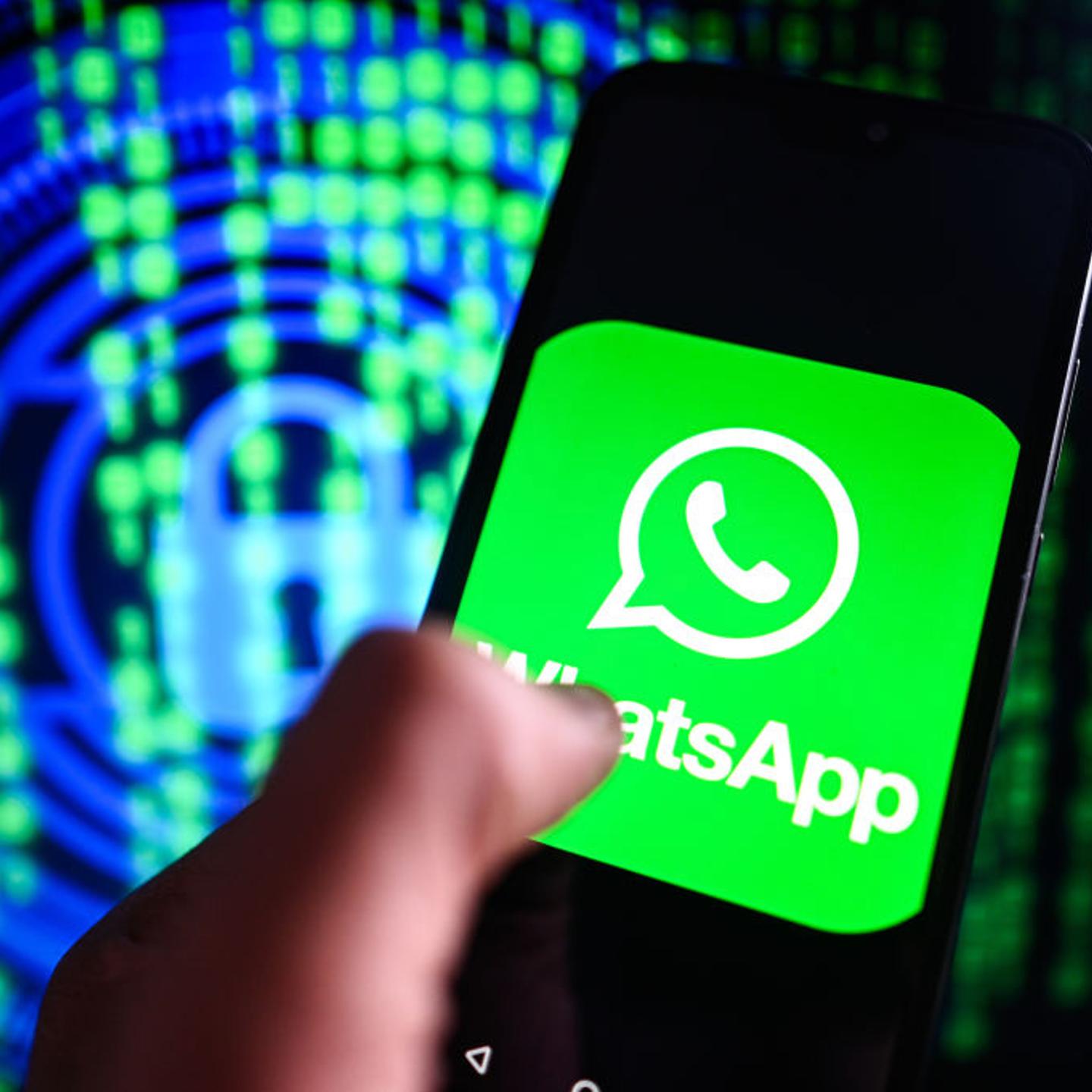 In this photo illustration a WhatsApp logo is displayed on a