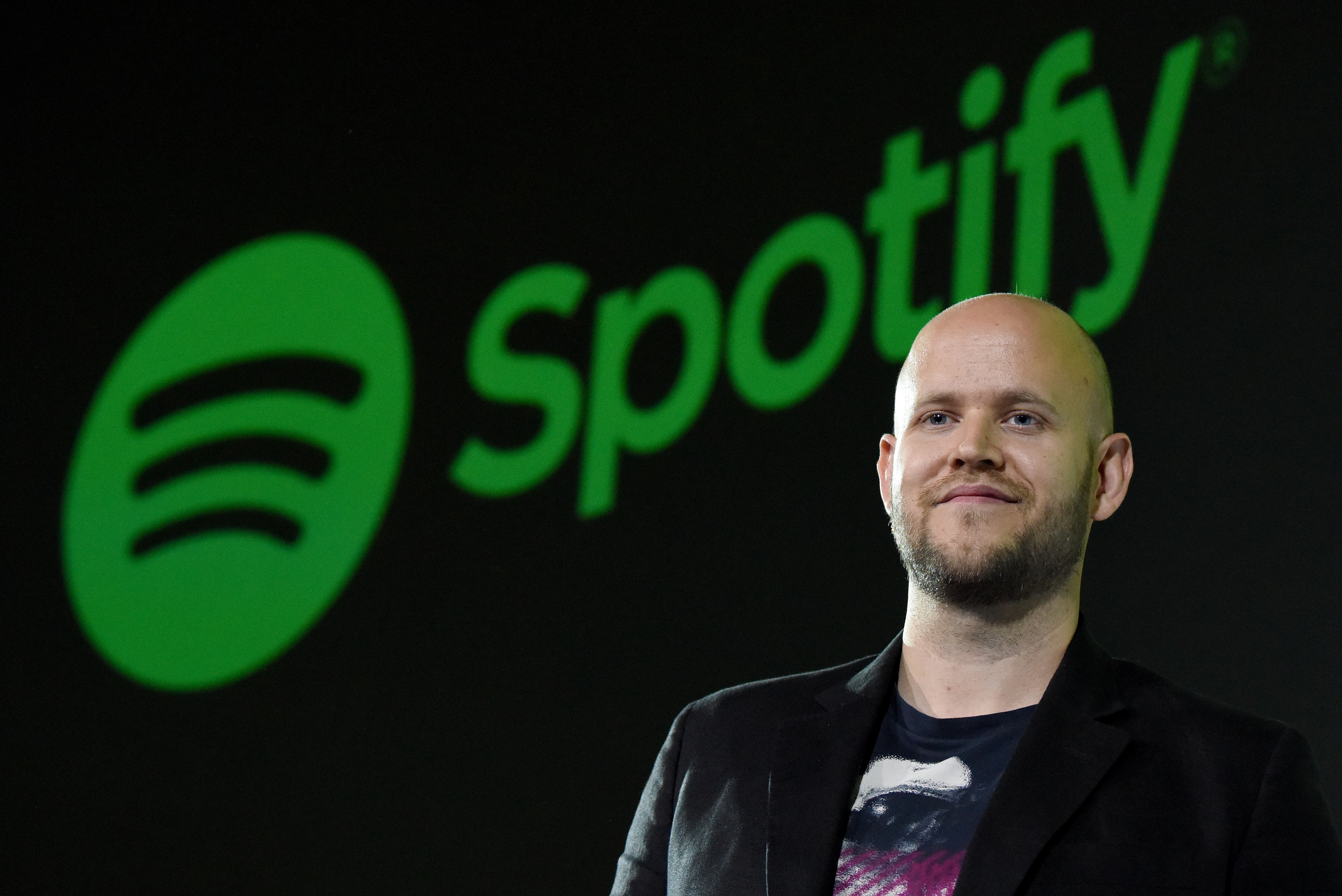 Daniel Ek, CEO of Swedish music streaming service Spotify, poses for photographers at a press conference in Tokyo on September 29, 2016.