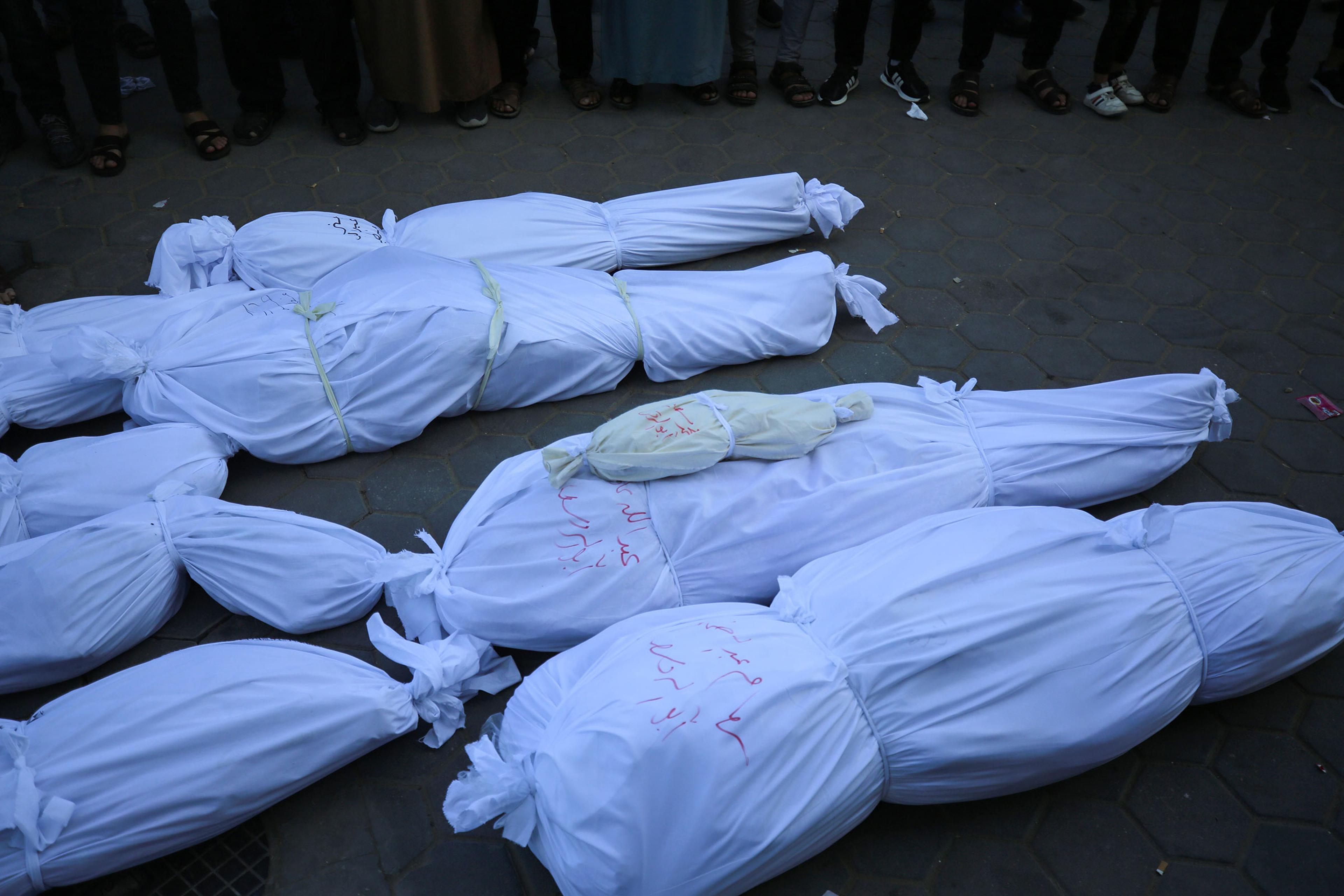 Relatives of the Palestinians, who lost their lives after Israeli attacks, mourn as the bodies are carried for burial outside Al Aqsa Martyrs Hospital in Deir al-Balah in the central Gaza Strip, on Oct. 31.