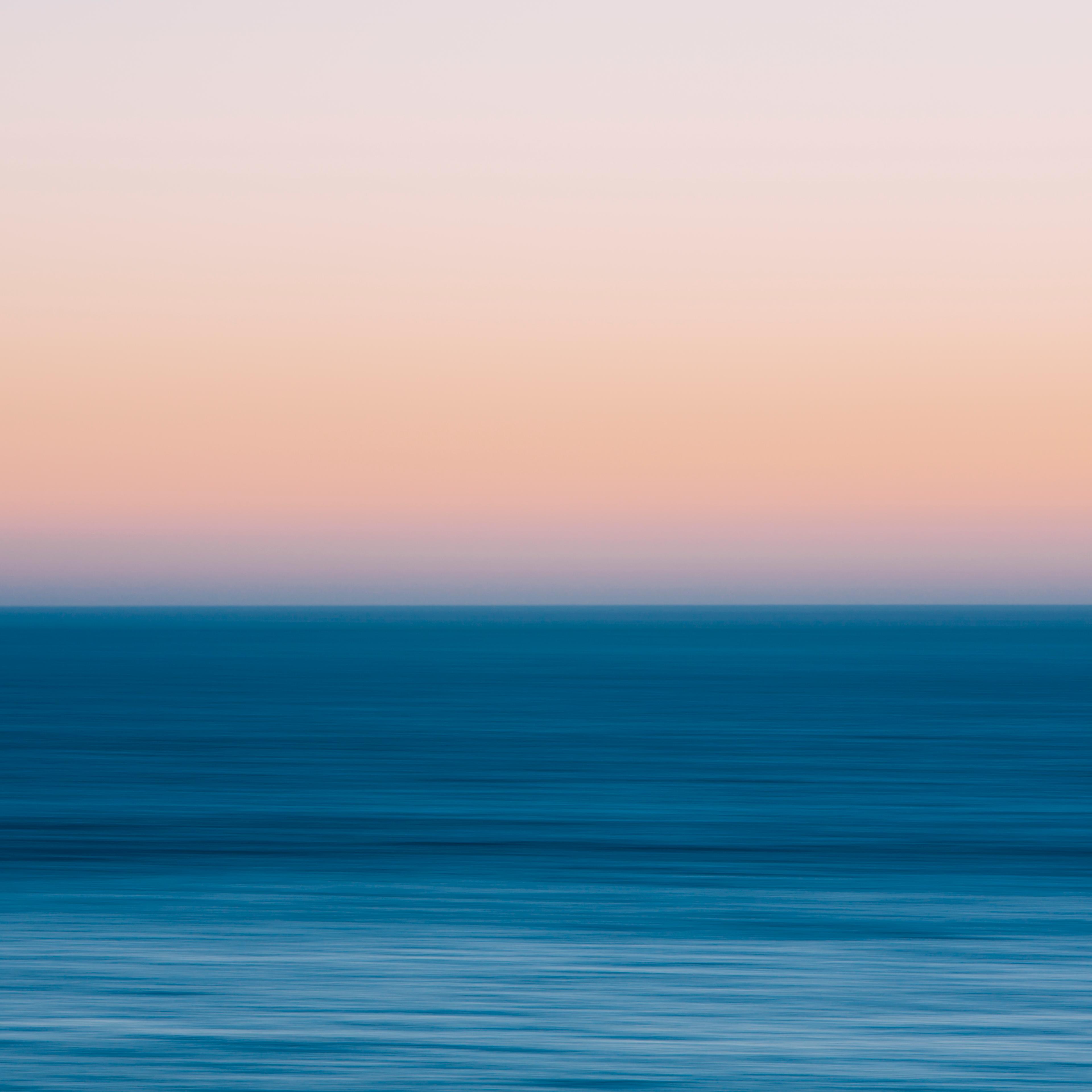 A view out to sea over the Pacific Ocean at dusk. Blurred motion.